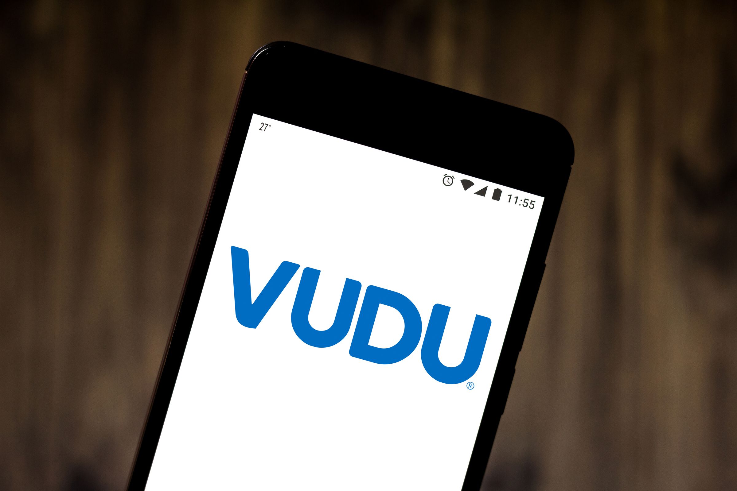In this photo illustration the Vudu logo is seen displayed...