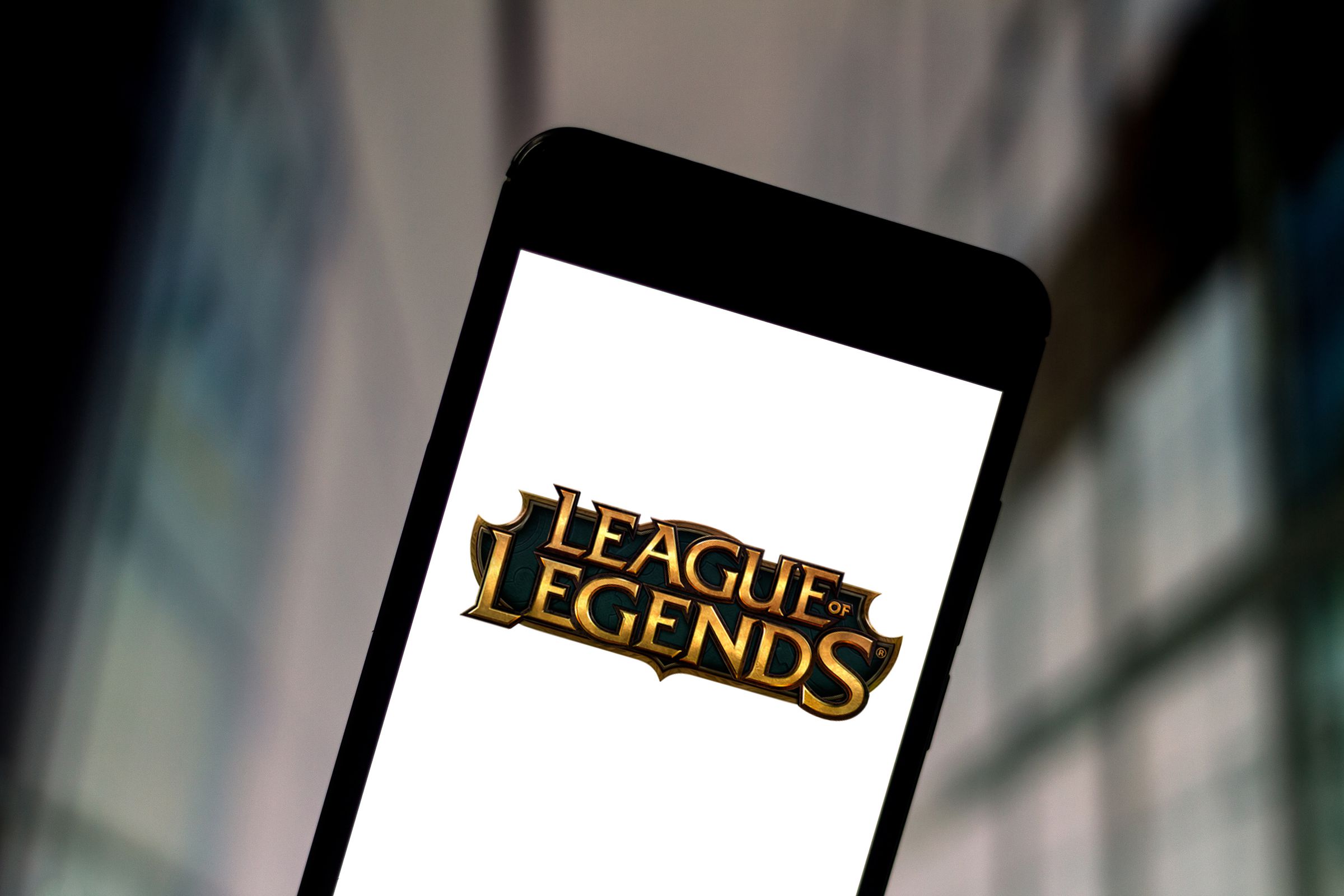 In this photo illustration a League of Legends logo seen...