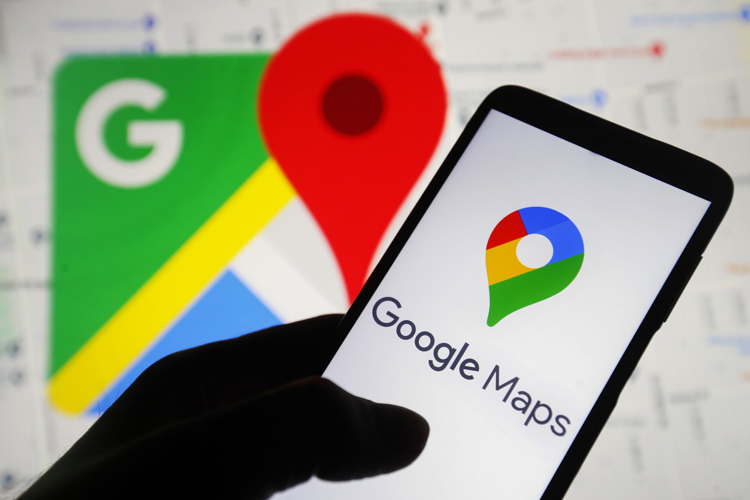 In this photo illustration, the Google Maps logo is seen on