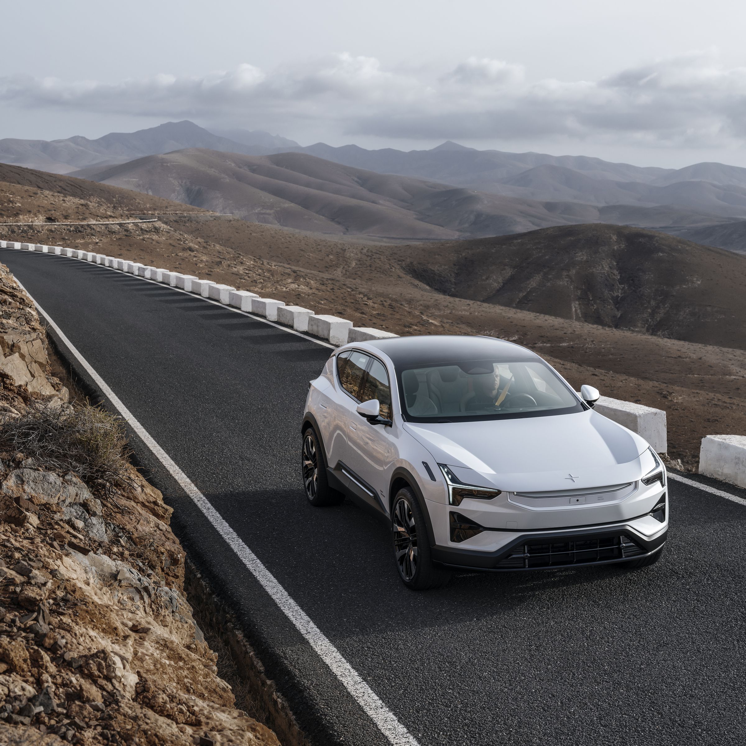 The Polestar 3 electric SUV driving down a mountain road