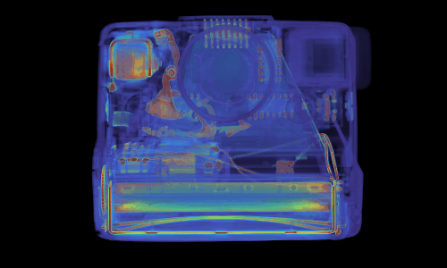 A see-through translucent blue 1970s Polaroid showing all its internal metal components in orange spins against a black background.