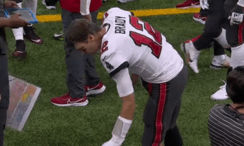 Tom Brady whips a Microsoft Surface tablet into the ground during a football game.