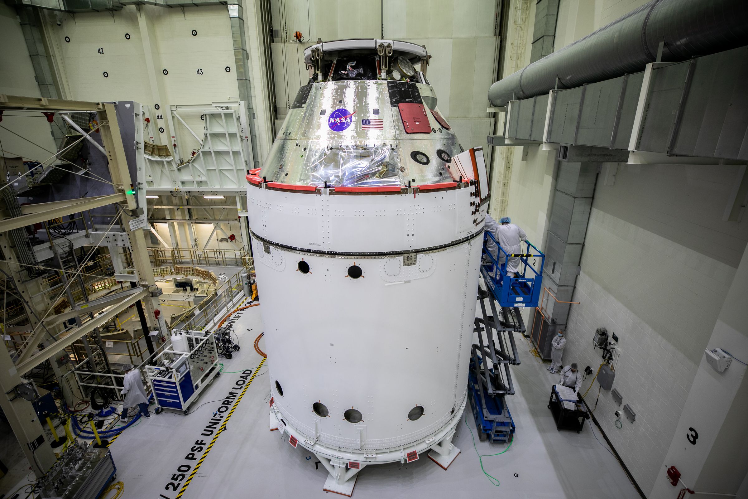 NASA’s Orion crew capsule, attached to the adapter and service module, with spacecraft adapter jettison fairings installed.