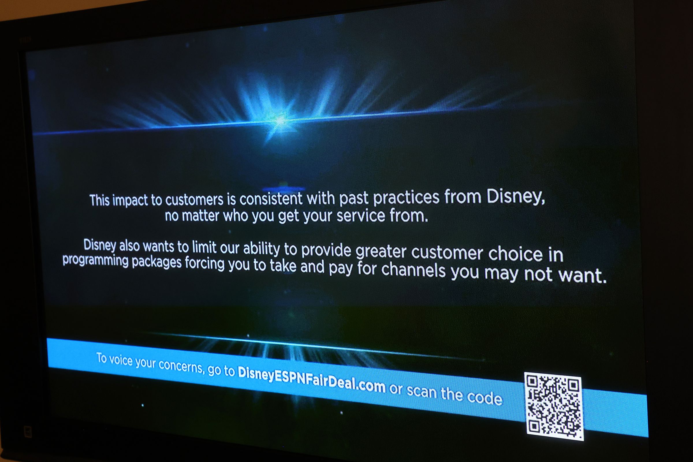 In this photo illustration, a blue screen message is displayed with QR code on Spectrum TV over the ESPN channel amid a dispute between Disney and Charter Spectrum.