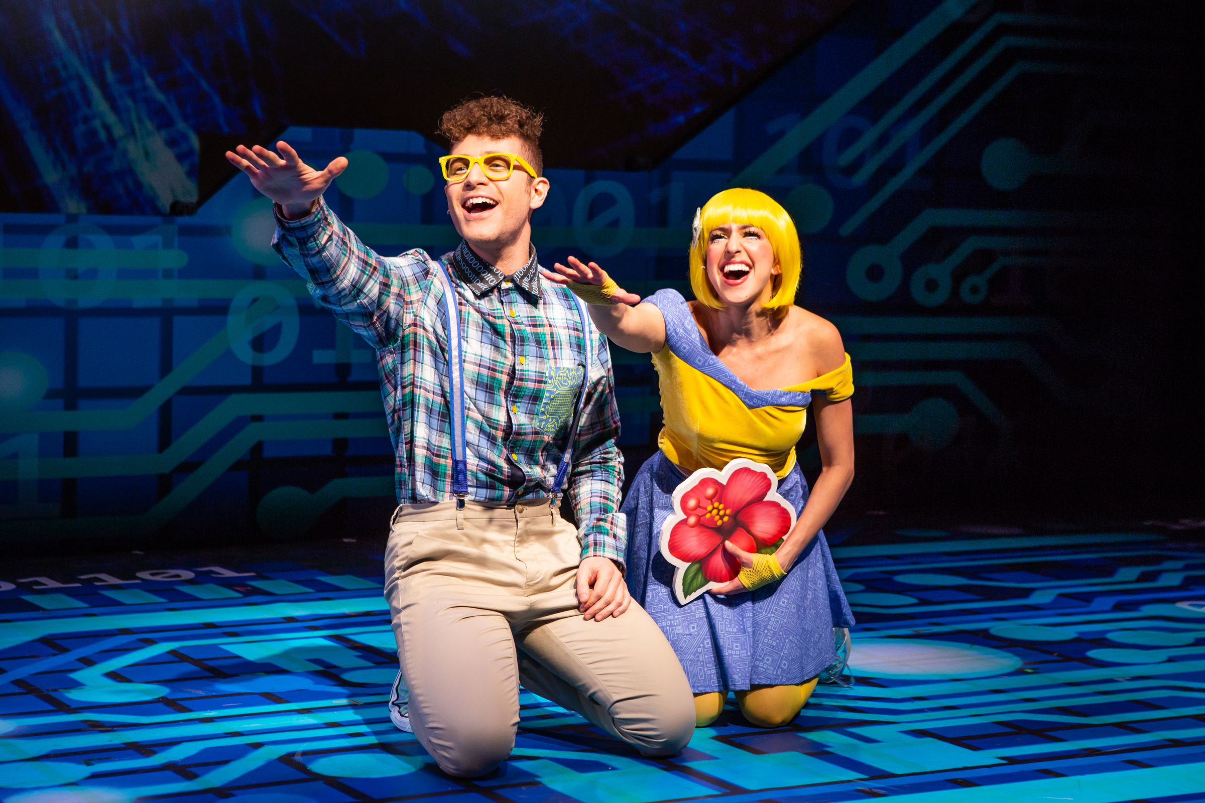 Keith Harrison (Nerd Face) and Laura Nicole Harrison (Smize) in the musical Emojiland