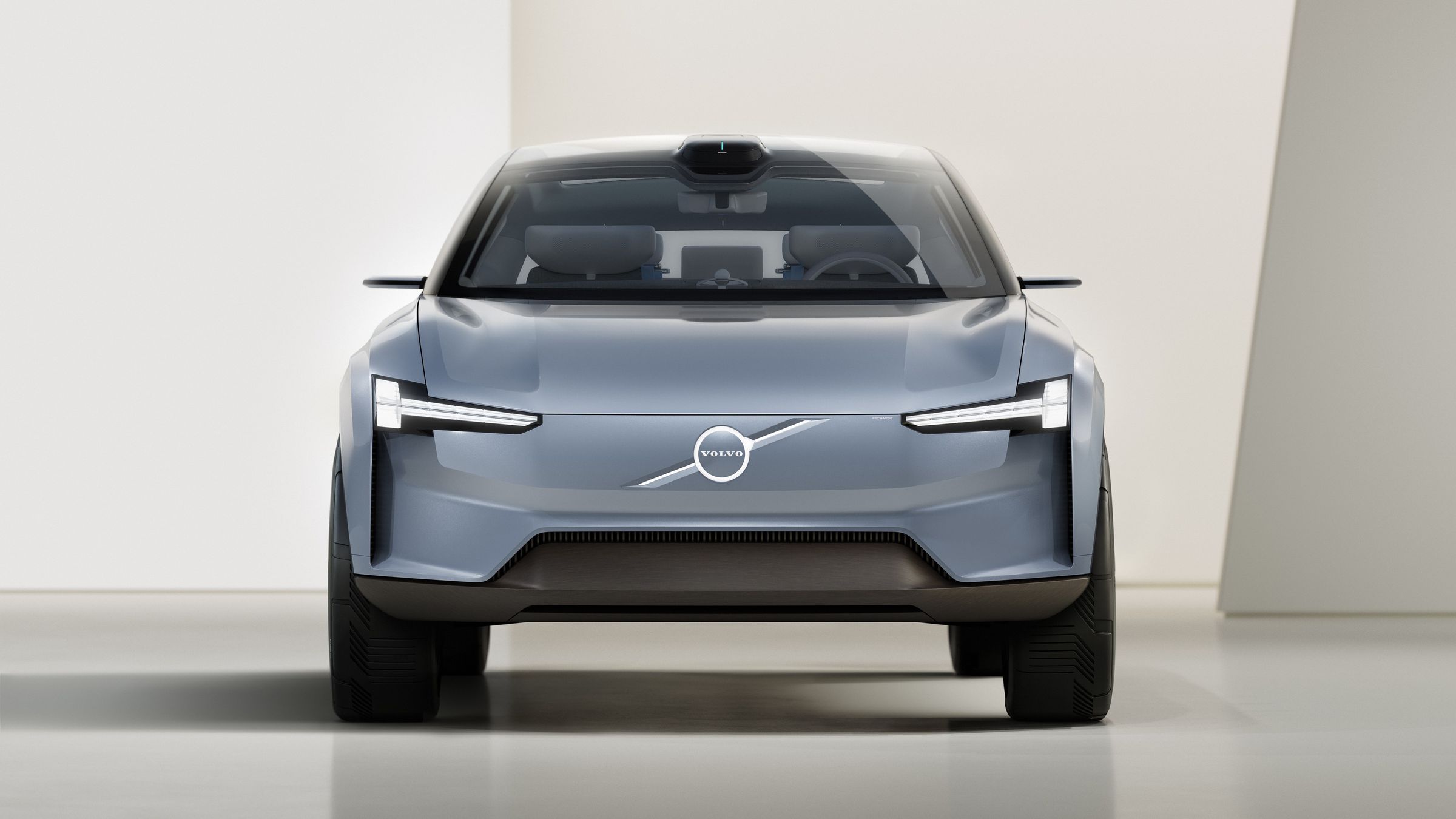 Volvo’s Concept Recharge is a rendering of a gray electric vehicle with the Volvo badge.