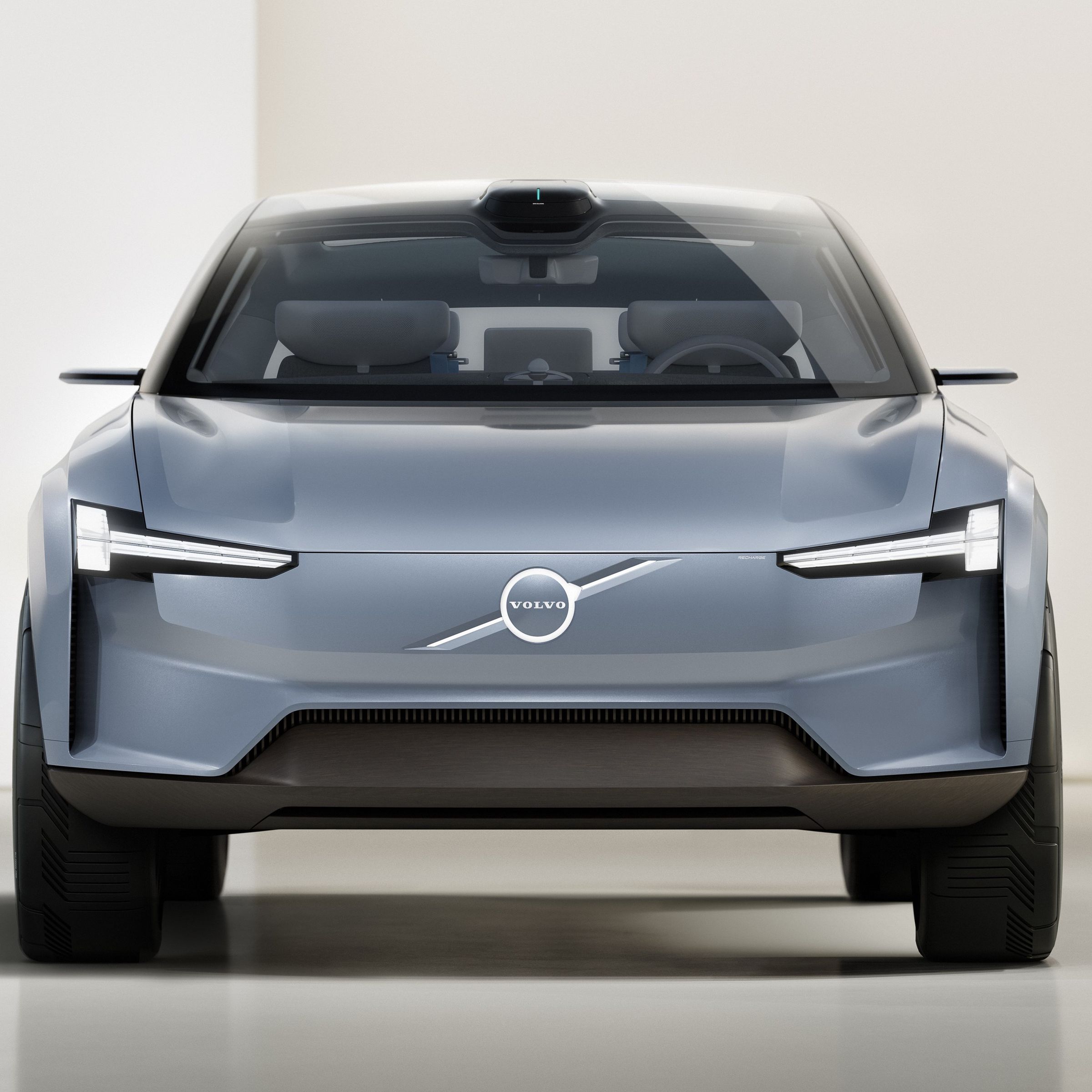 Volvo’s Concept Recharge is a rendering of a gray electric vehicle with the Volvo badge.