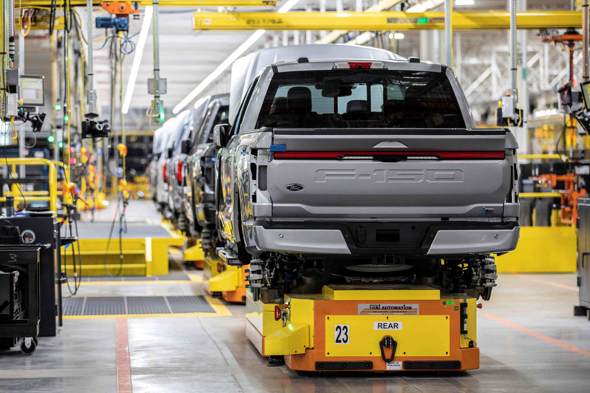 An image showing a Ford F-150 Lightning in a factory