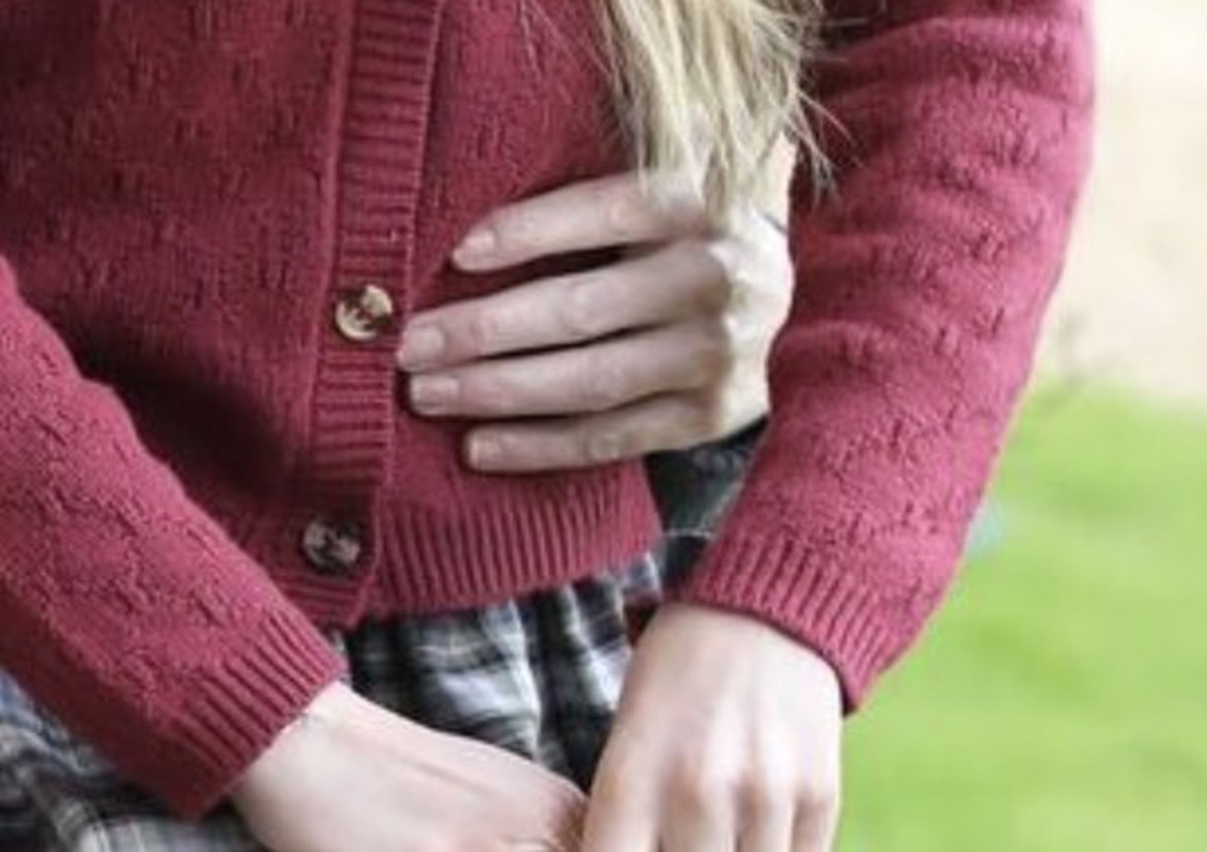 An image of a skirt photoshopped over a girl’s sweater.