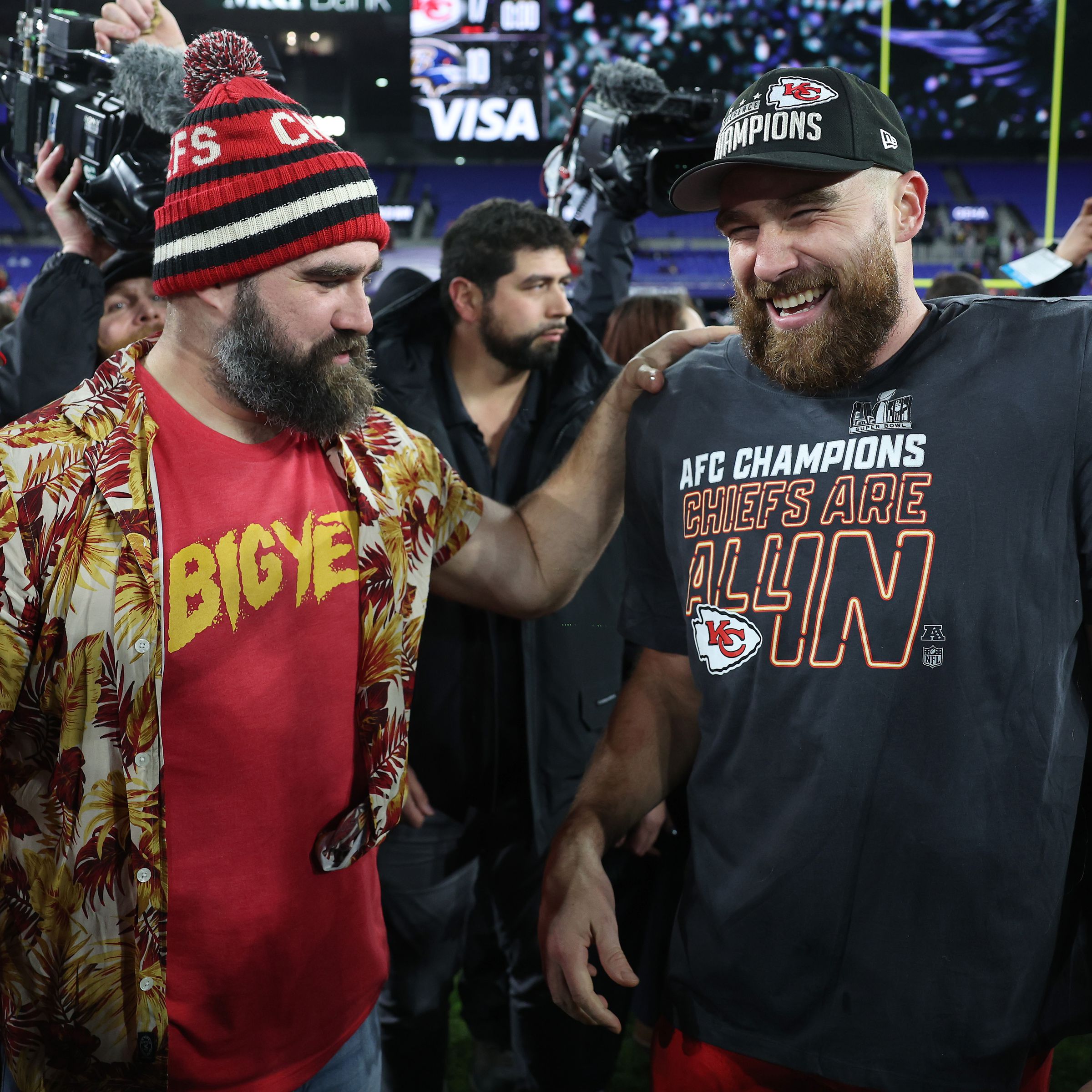 The Kelce brothers standing together.