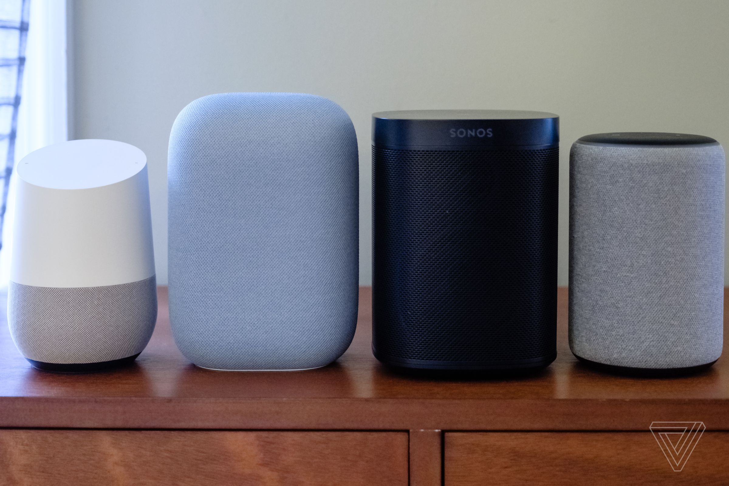 The Nest Audio (second from left) is taller than the original Google Home (left) but about the same height as the Sonos One (second from right) and 2019 Amazon Echo (right).
