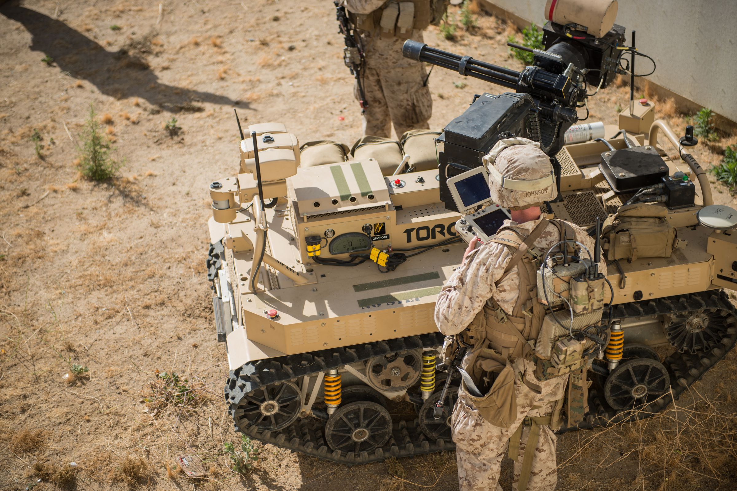 A remote-controlled robot equipped with a machine gun under development by the United States Marine Corps.