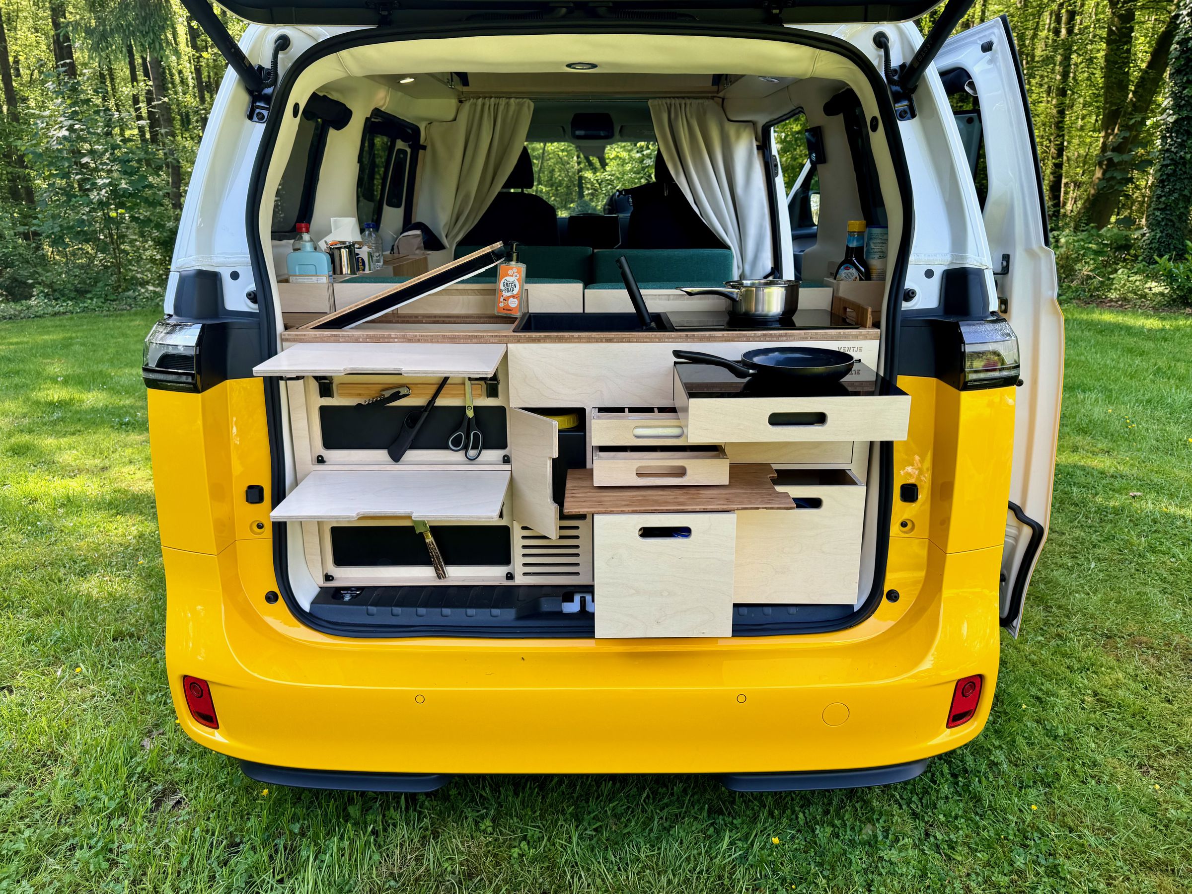 <em>Another view of the kitchen protected from rain and sun (when the window covering is closed) by the lifted tailgate.</em>