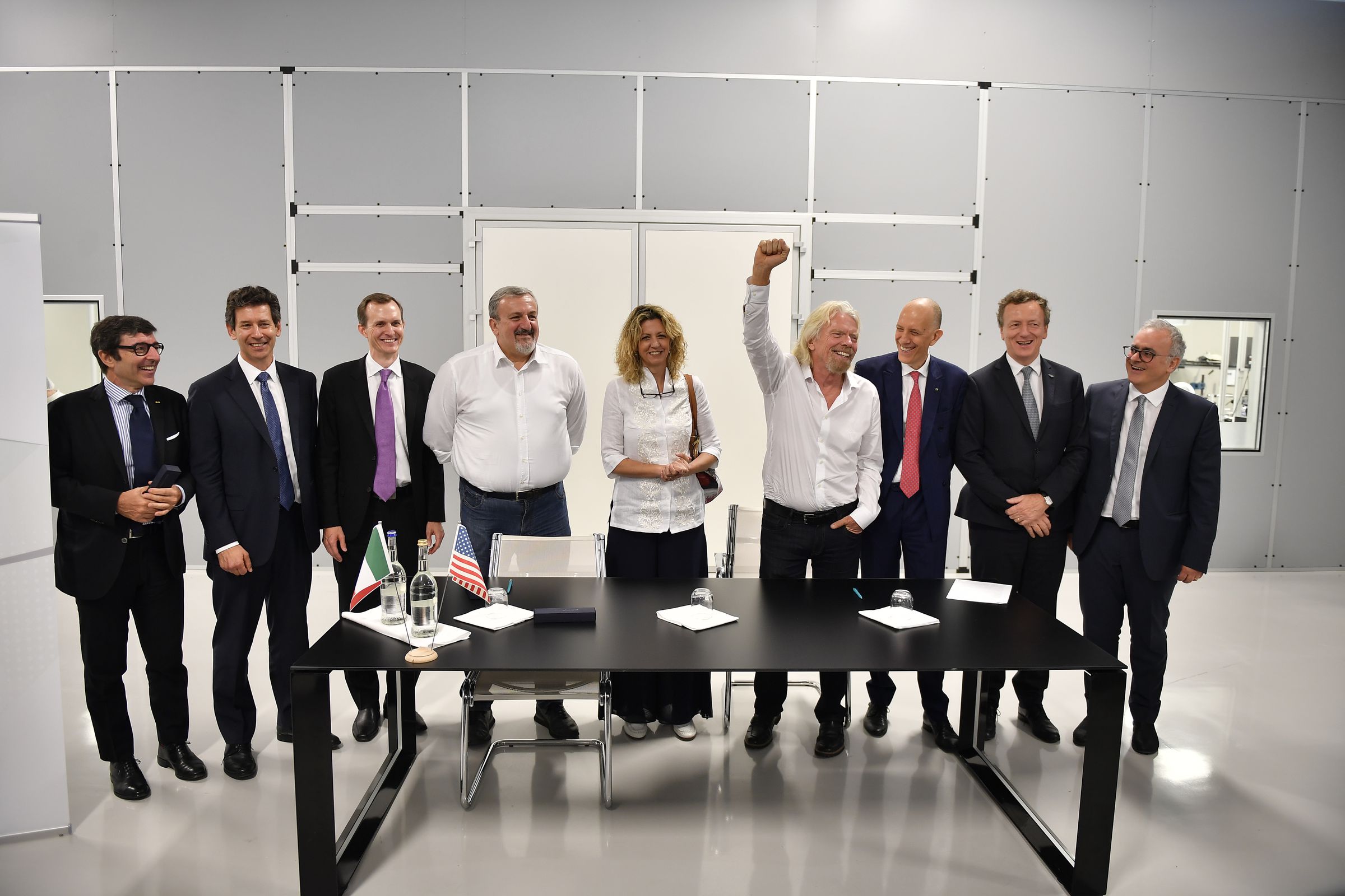 Virgin CEO Richard Branson along with members of the Italian government and aerospace industry