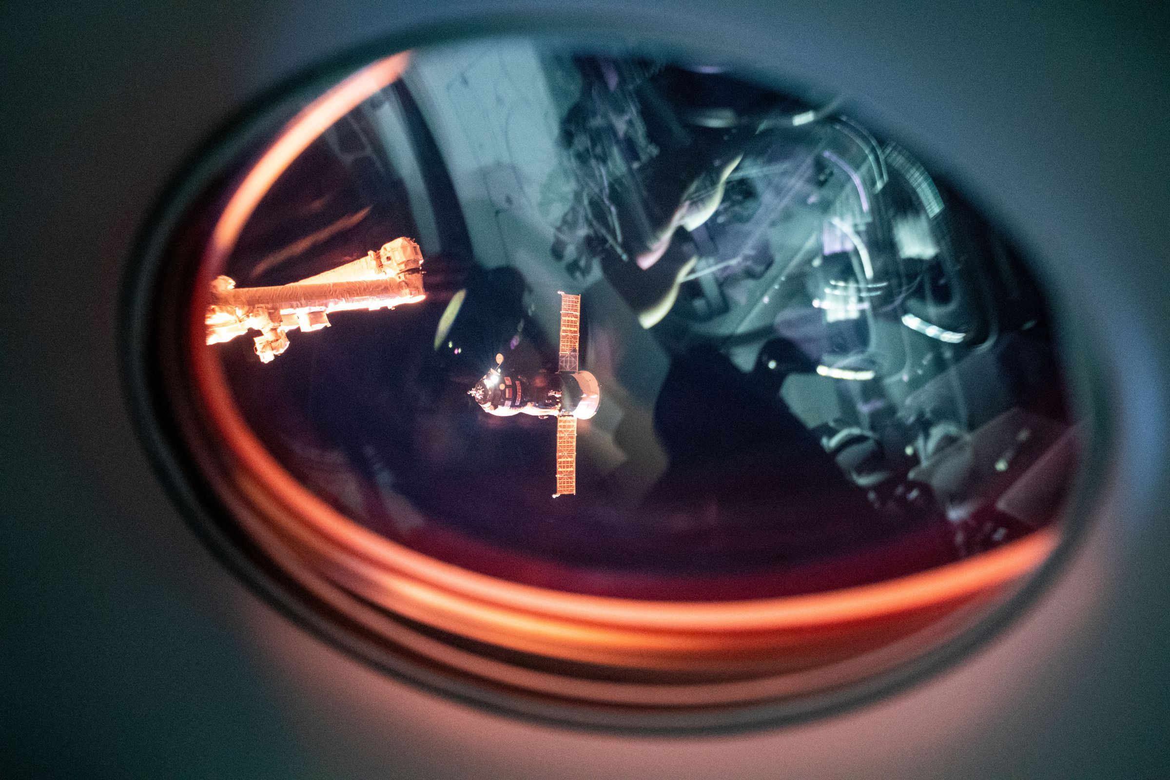 Russia’s Progress 77 cargo resupply ship is seen approaching the International Space Station through the window of SpaceX’s Crew Dragon spacecraft.