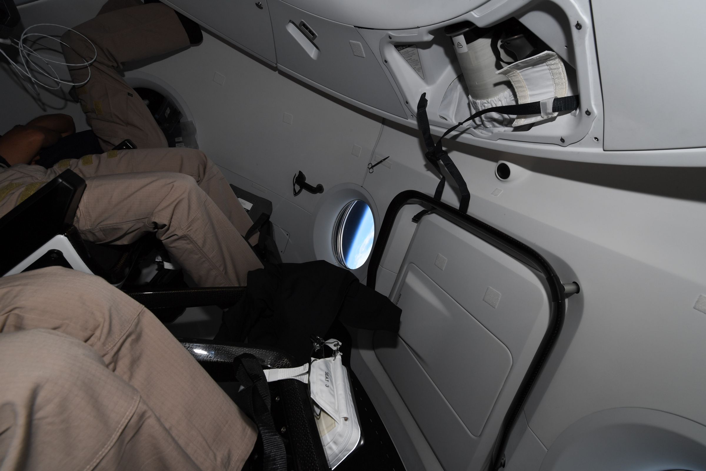 A glimpse at the toilet inside the Crew Dragon.