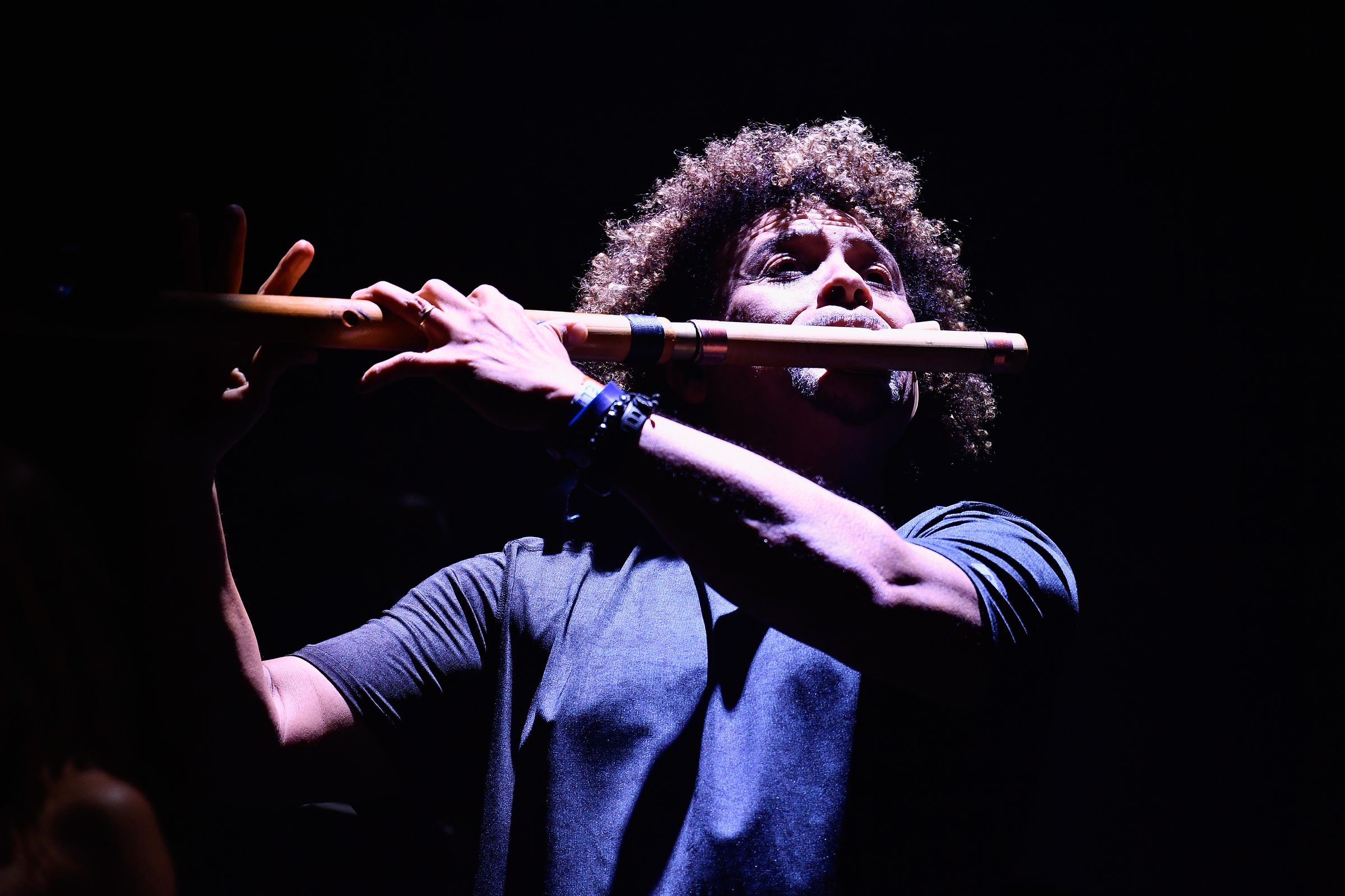 A photo of Pedro Eustache playing the flute