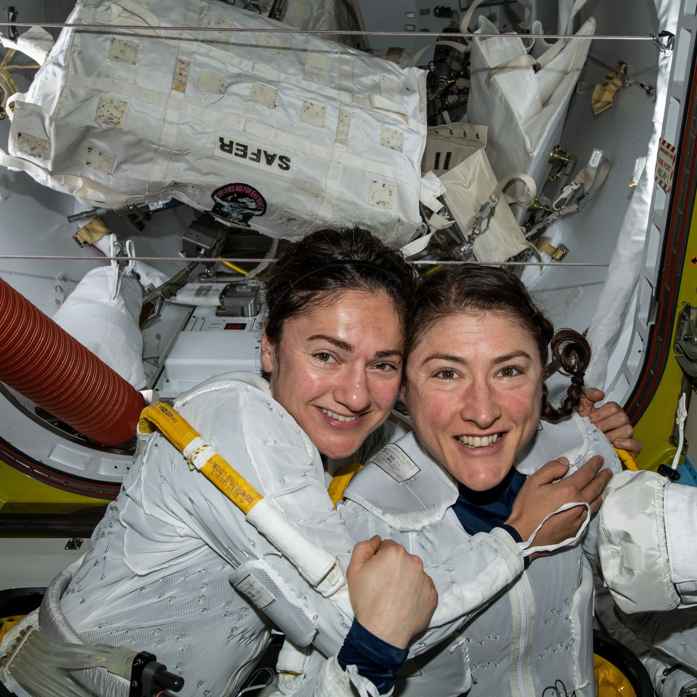 NASA astronauts Jessica Meir (L) and Christina Koch (R), preparing to leave the International Space Station for the first all-female spacewalk
