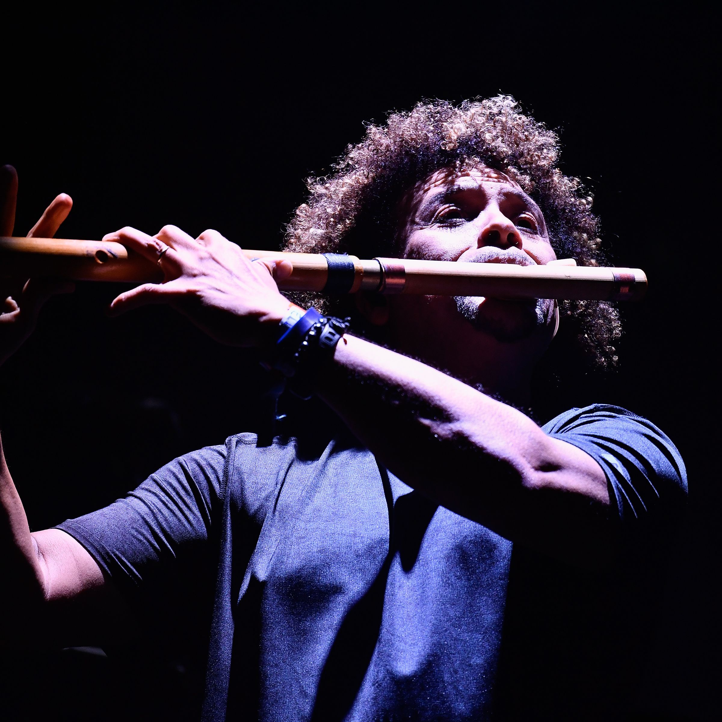 A photo of Pedro Eustache playing the flute