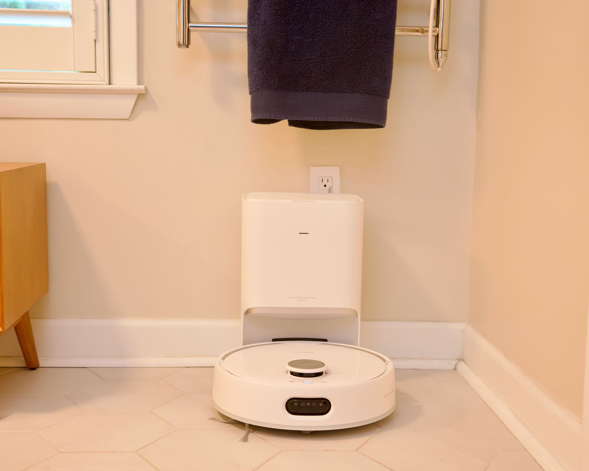 The SwitchBot S10 has two docks, a regular charging station that auto-empties, and a separate water station that can hook into your plumbing.
