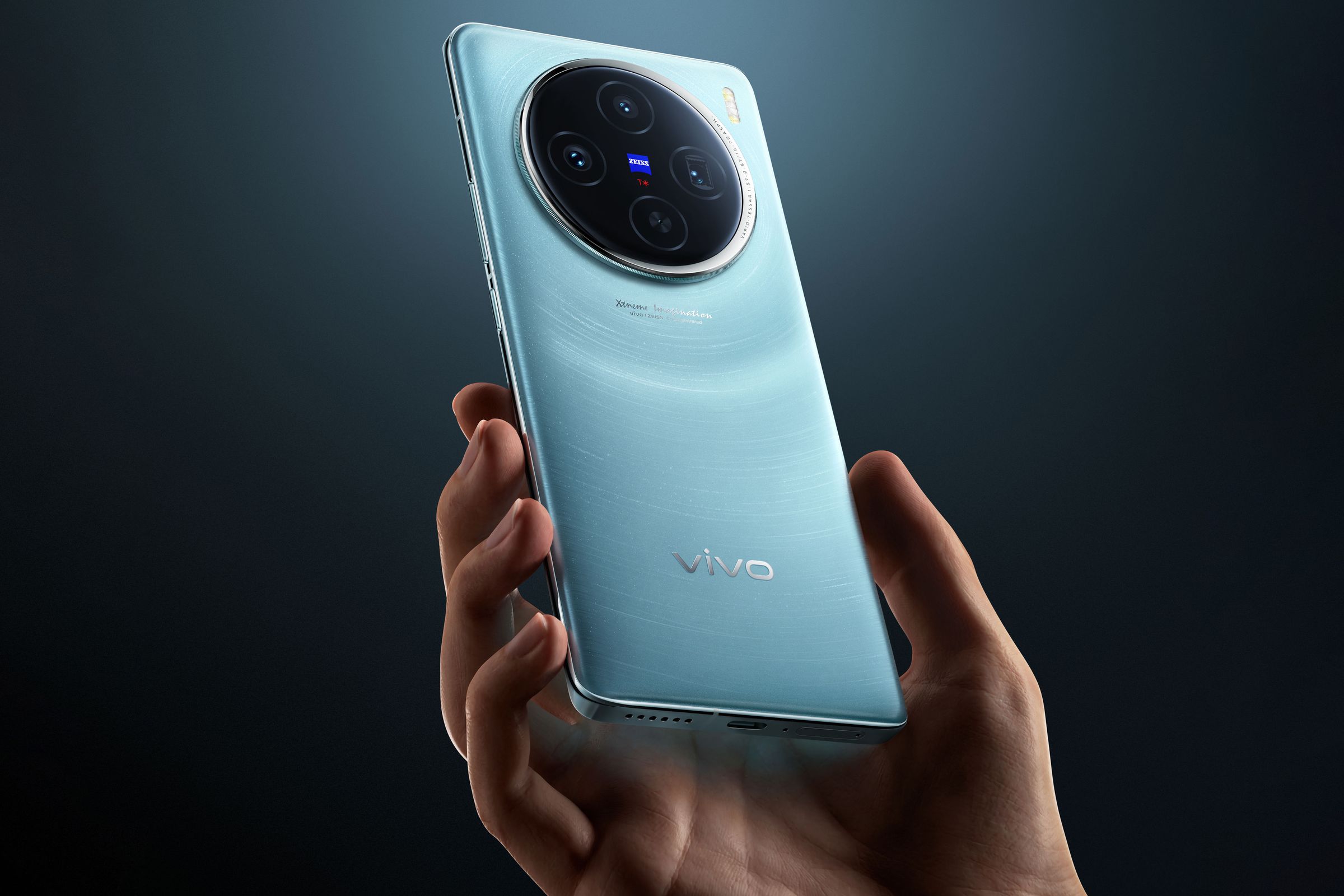 Vivo X100, held in hand, rear to camera.