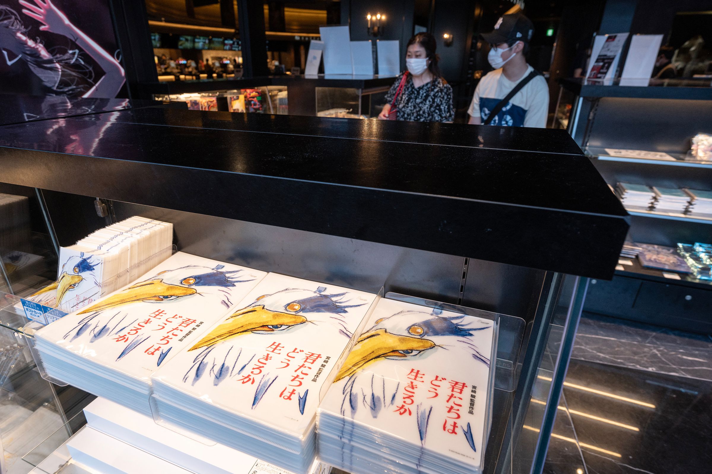 Merchandise for Oscar-winning animator Hayao Miyazaki’s latest film, titled in English “How Do You Live?” is displayed for sale at a cinema on the first day of the film’s premiere in Tokyo on July 14, 2023.