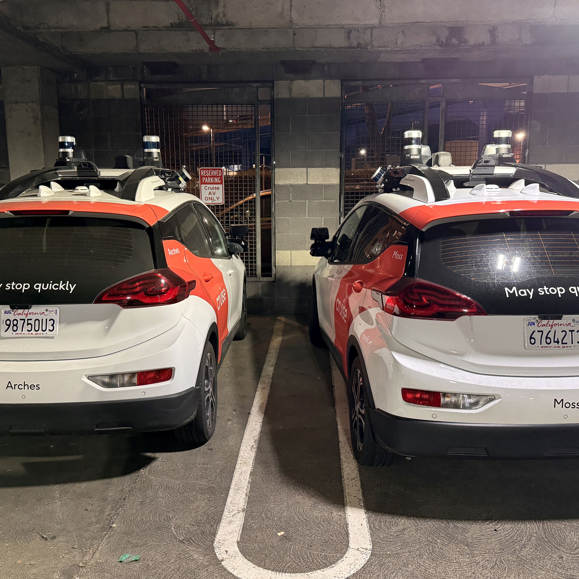 Cruise driverless vehicles in a parking garage.