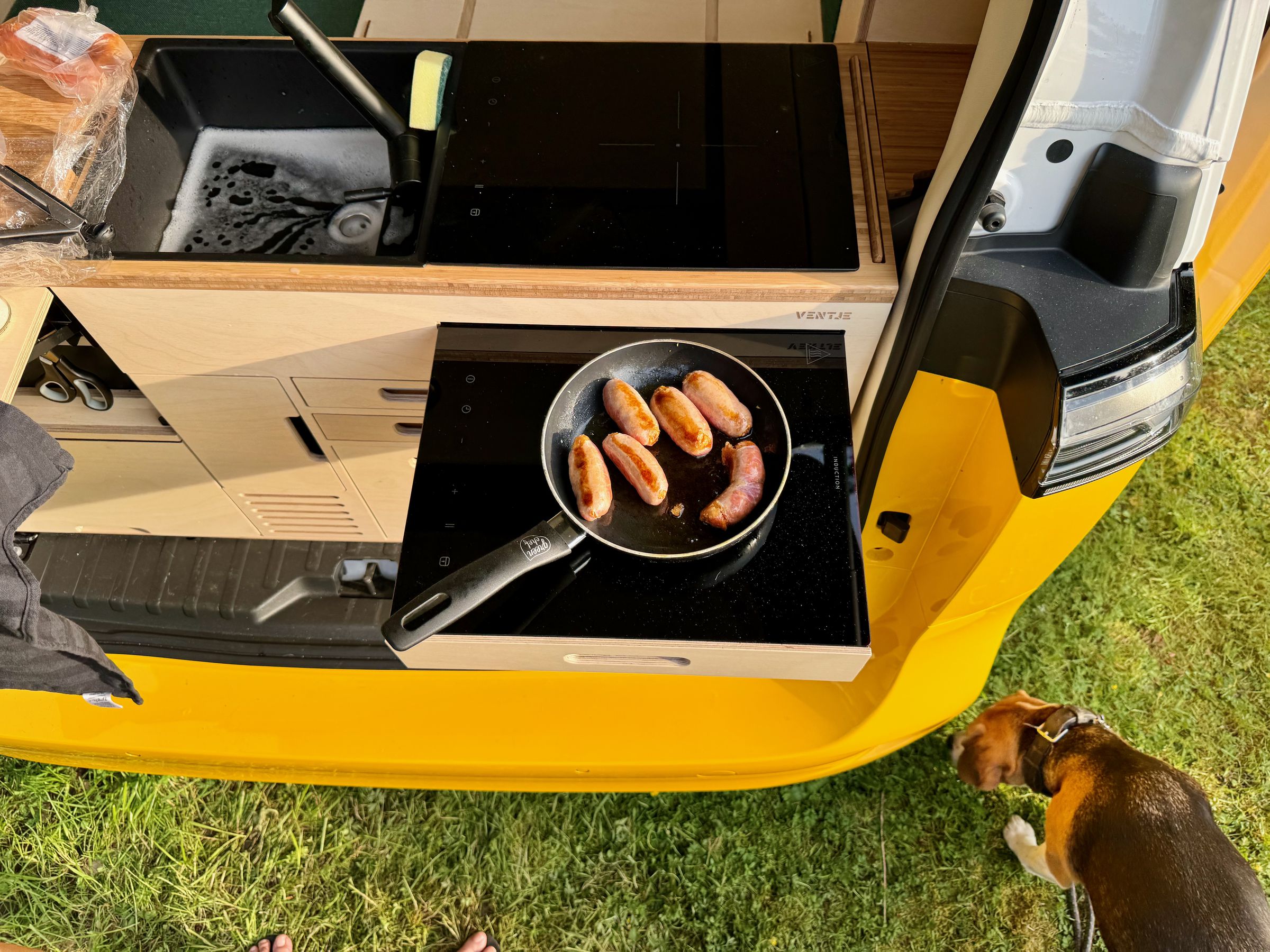 <em>Using the second pop-out induction cooktop.</em>