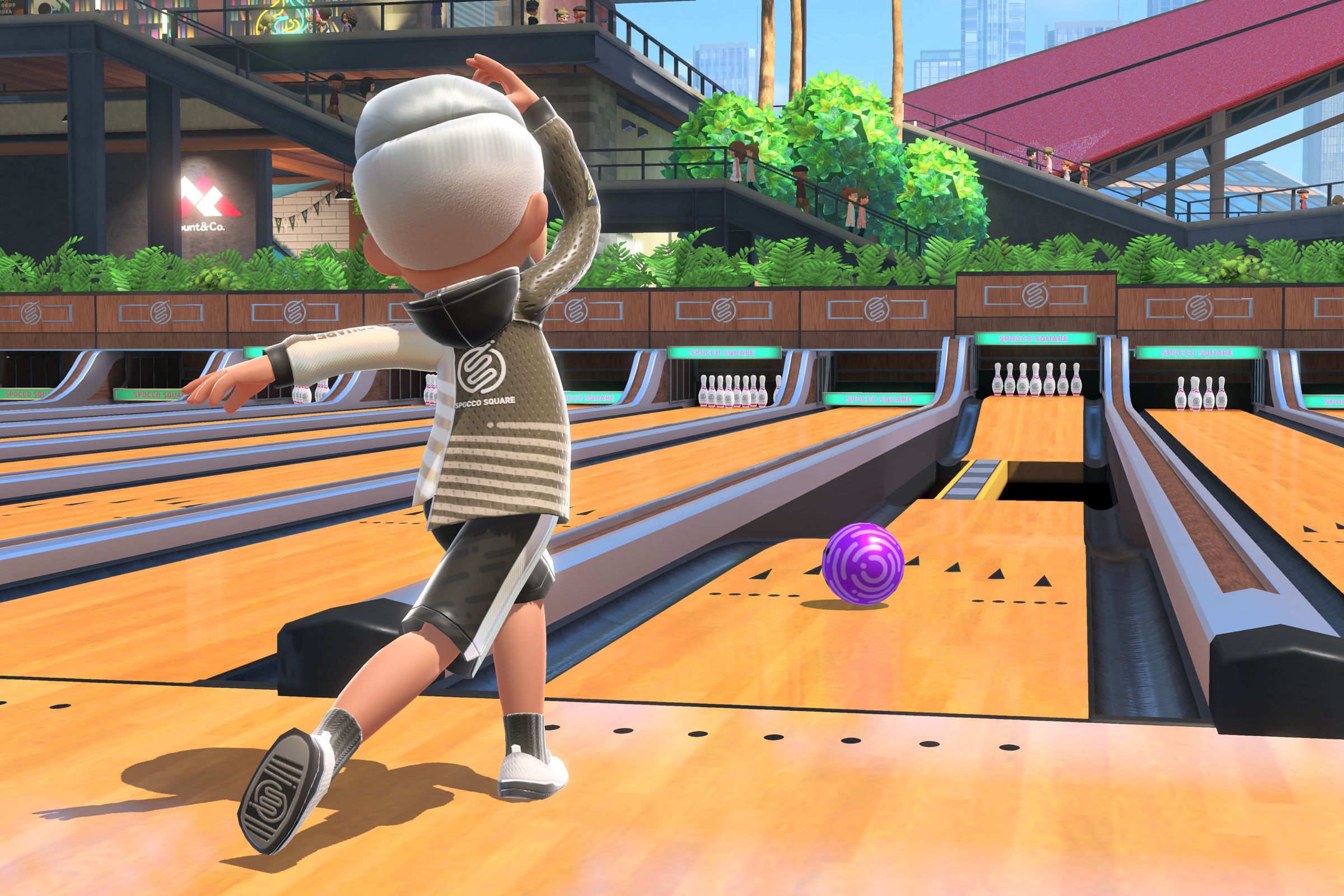In a screenshot from Nintendo Switch Sports, a bowler tosses the ball down a lane with a narrow path and a ramp.