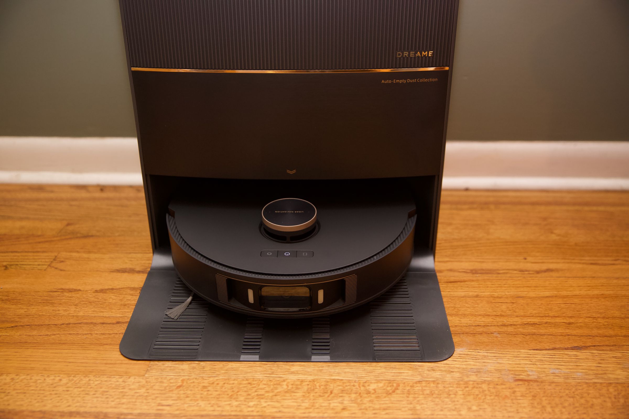 The DreameBot L20 Ultra robot vacuum and mop sitting docked in its auto-emptying station.