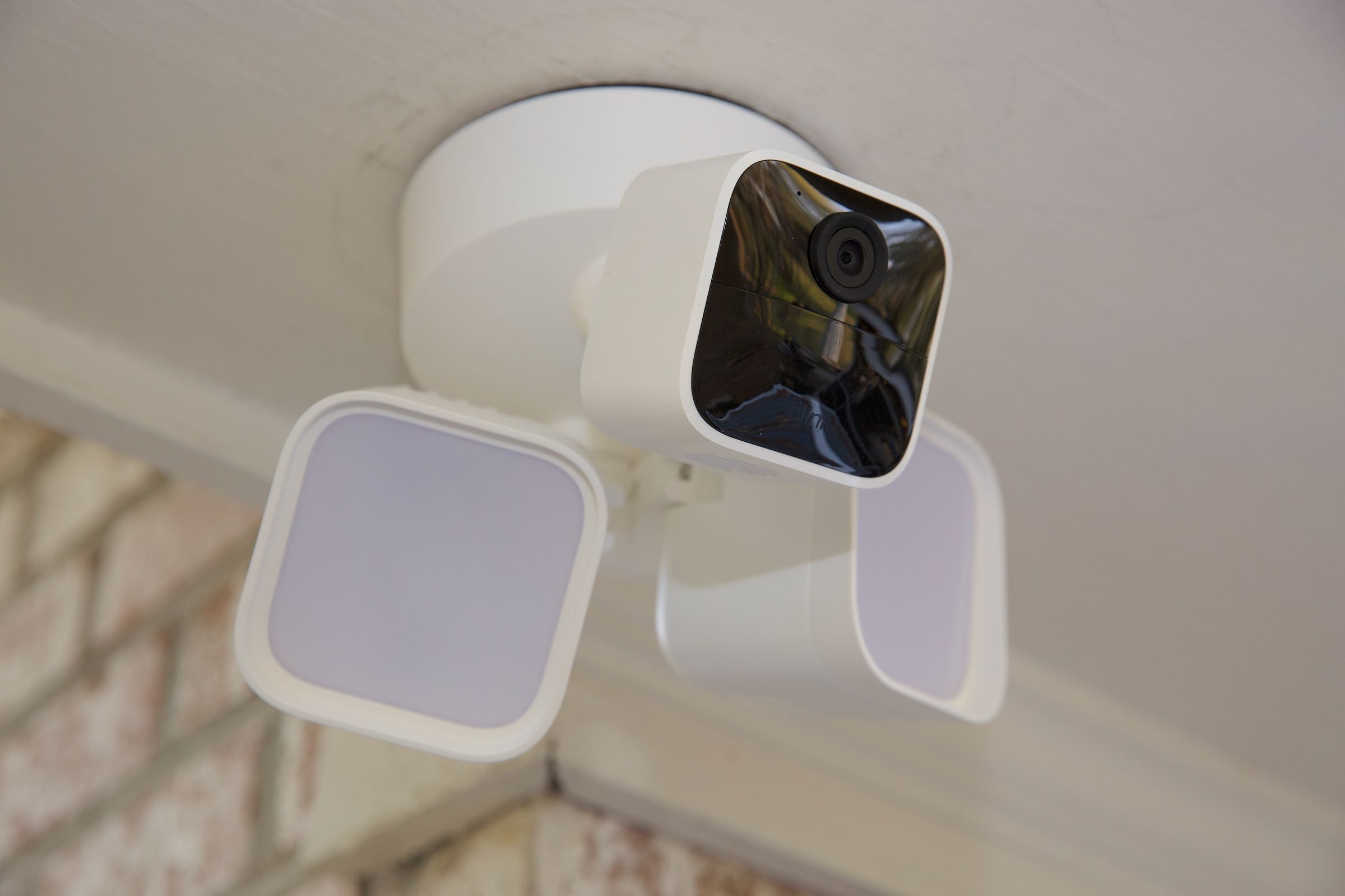 Blink’s Wired Floodlight Camera mounted up on a porch.