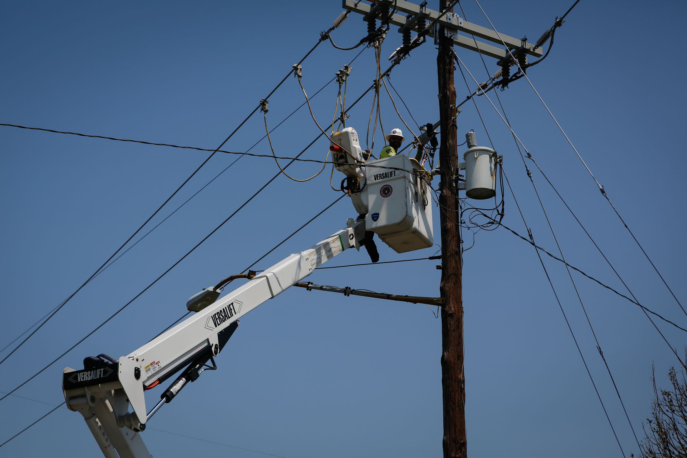 A worker repairs a utility pole during a power outage after Hurricane Ida in New Orleans, Louisiana, U.S., on Thursday, September 2nd, 2021.
