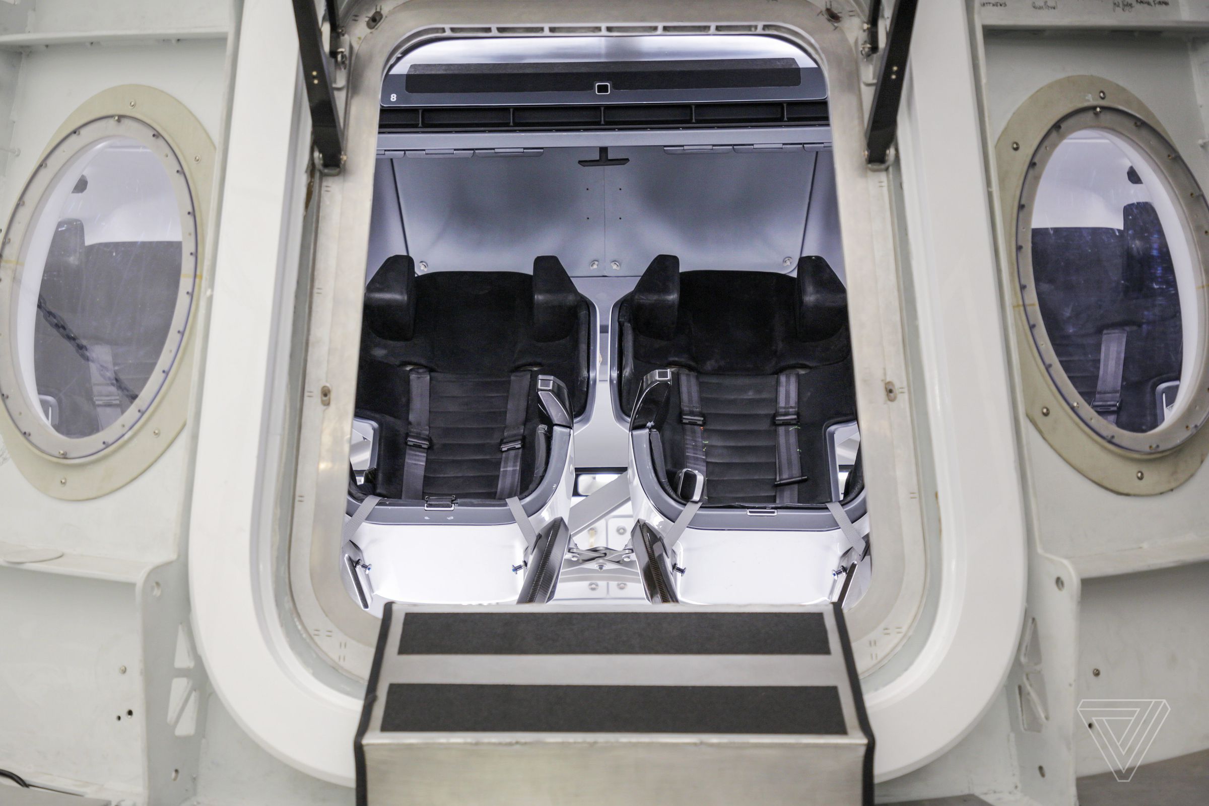 A view inside the Crew Dragon capsule simulator.