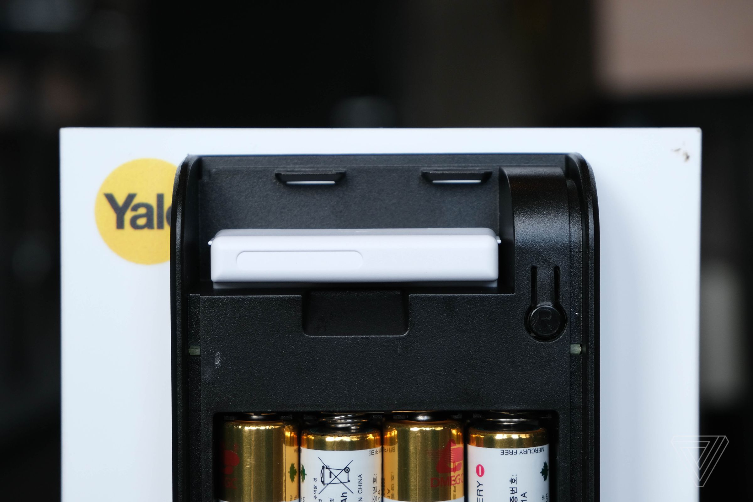 The module plugs into the battery compartment of the Yale smart lock.