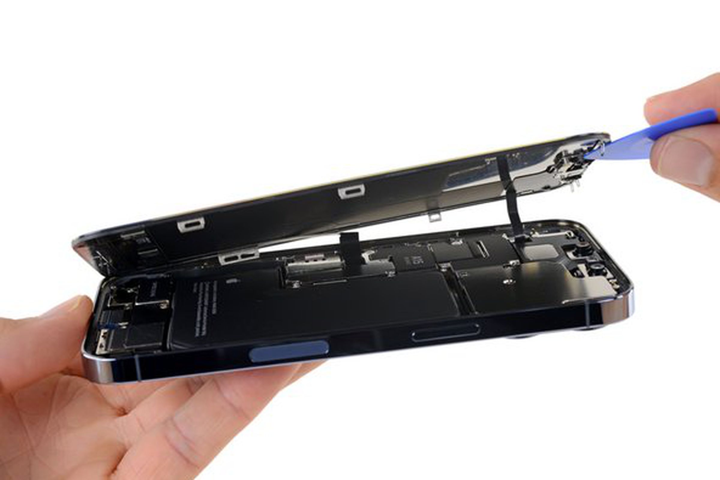 A repair tutorial from iFixit shows a user accessing the internal electronics of an iPhone