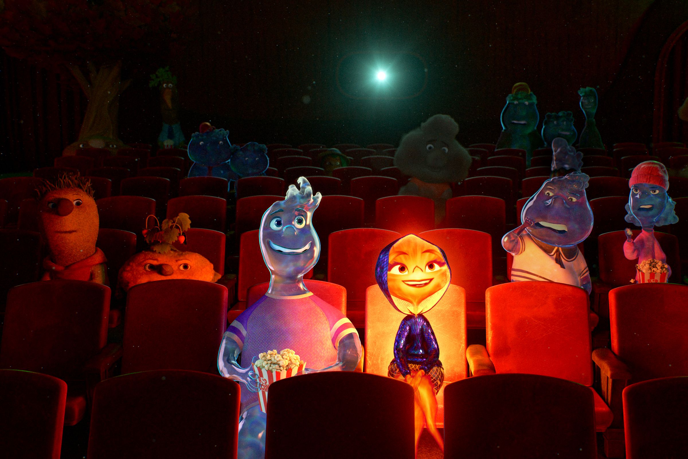 A humanoid man made entirely of water sitting next to a humanoid woman made of flames. The pair are seated next to one another in a dark movie theater illuminated only by the light shining from a projector in the distant background and from the light emanating from the woman’s body.