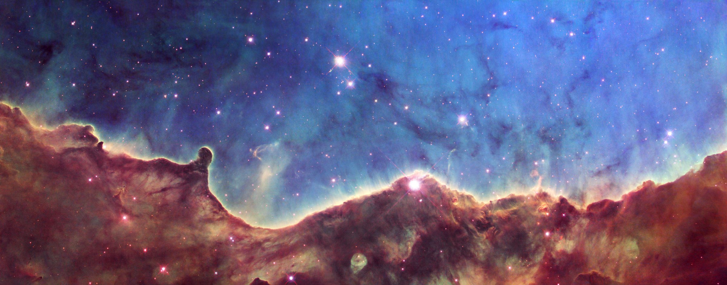 Hubble’s view of the Carina Nebula’s “Cosmic Cliffs.”