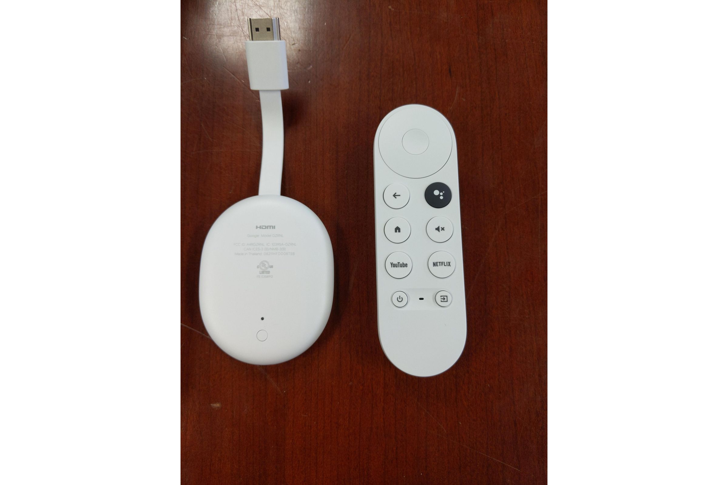 Photos show off the dongle and its remote control.