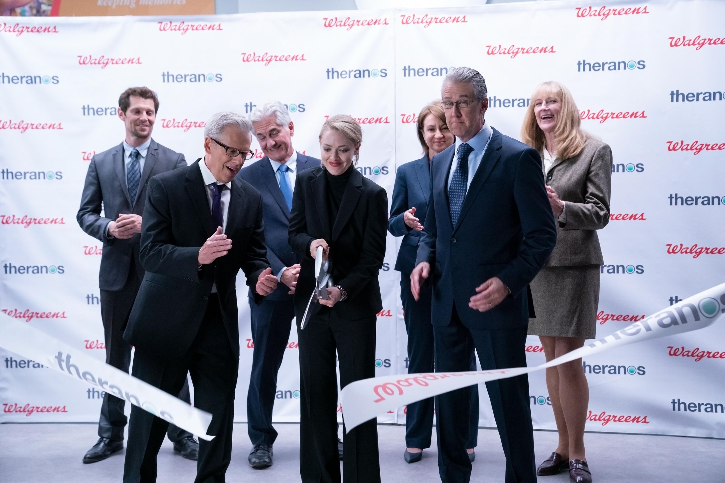 Holmes attending a ribbon cutting ceremony with her new Walgreens partners.