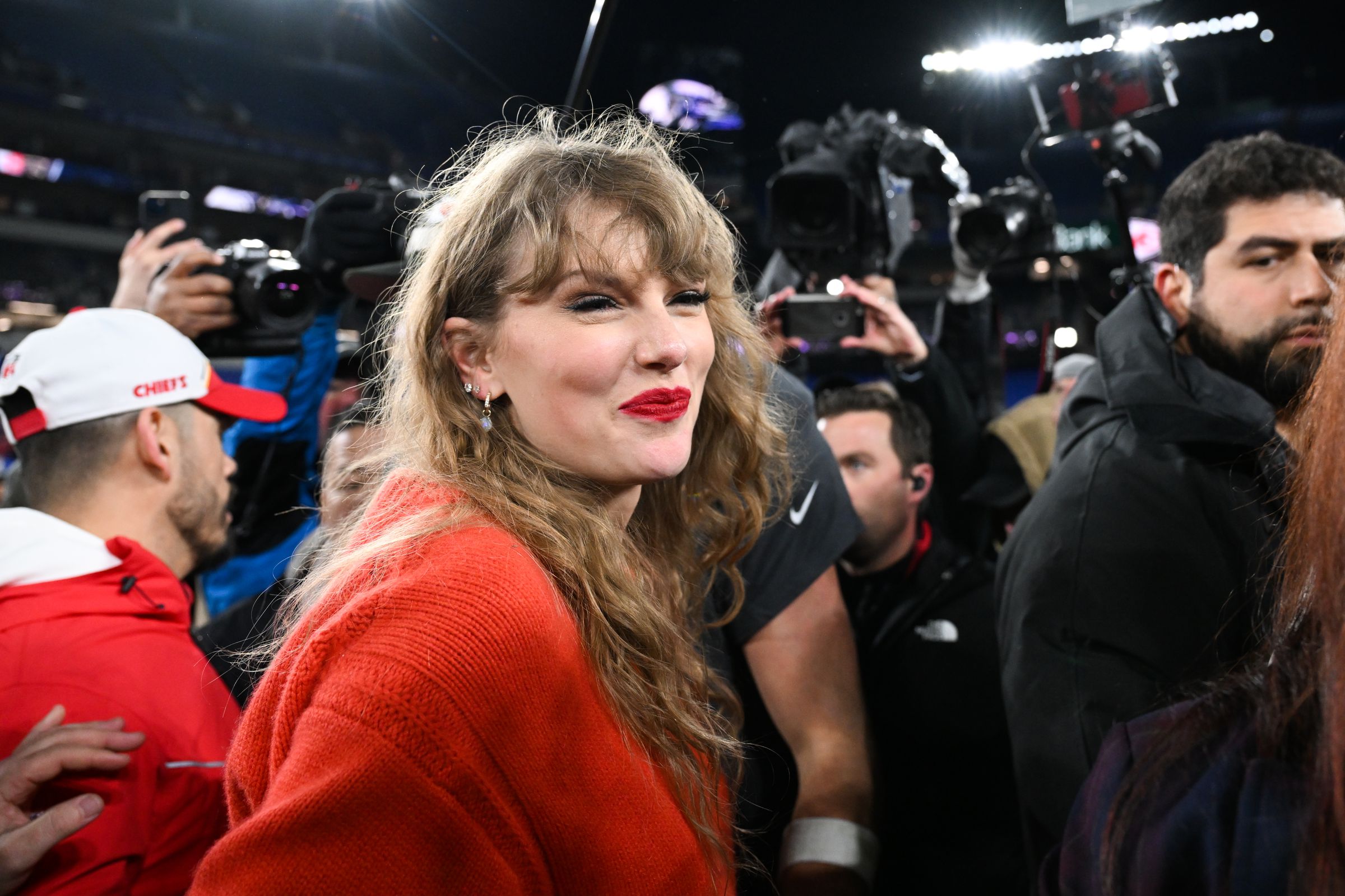 Taylor Swift walks off the field following the AFC Championship between the Kansas City Chiefs and the Baltimore Ravens