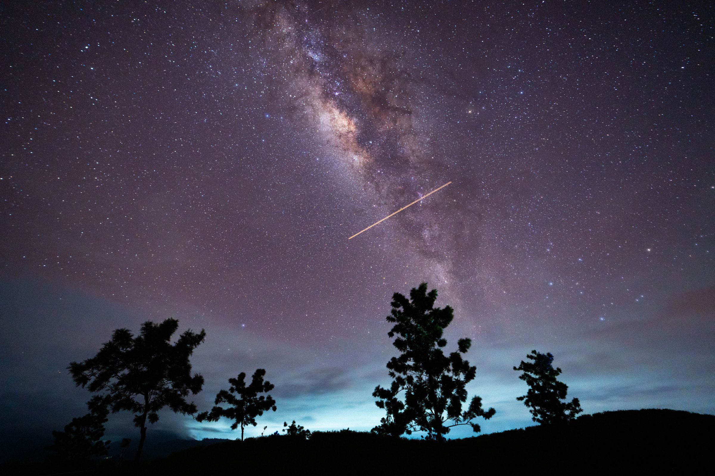 A flight-illuminated path and the Milky Way are appearing in the night sky during the Eta Aquarids meteor shower, which is peaking in Ratnapura, Sri Lanka, on May 5, 2024.