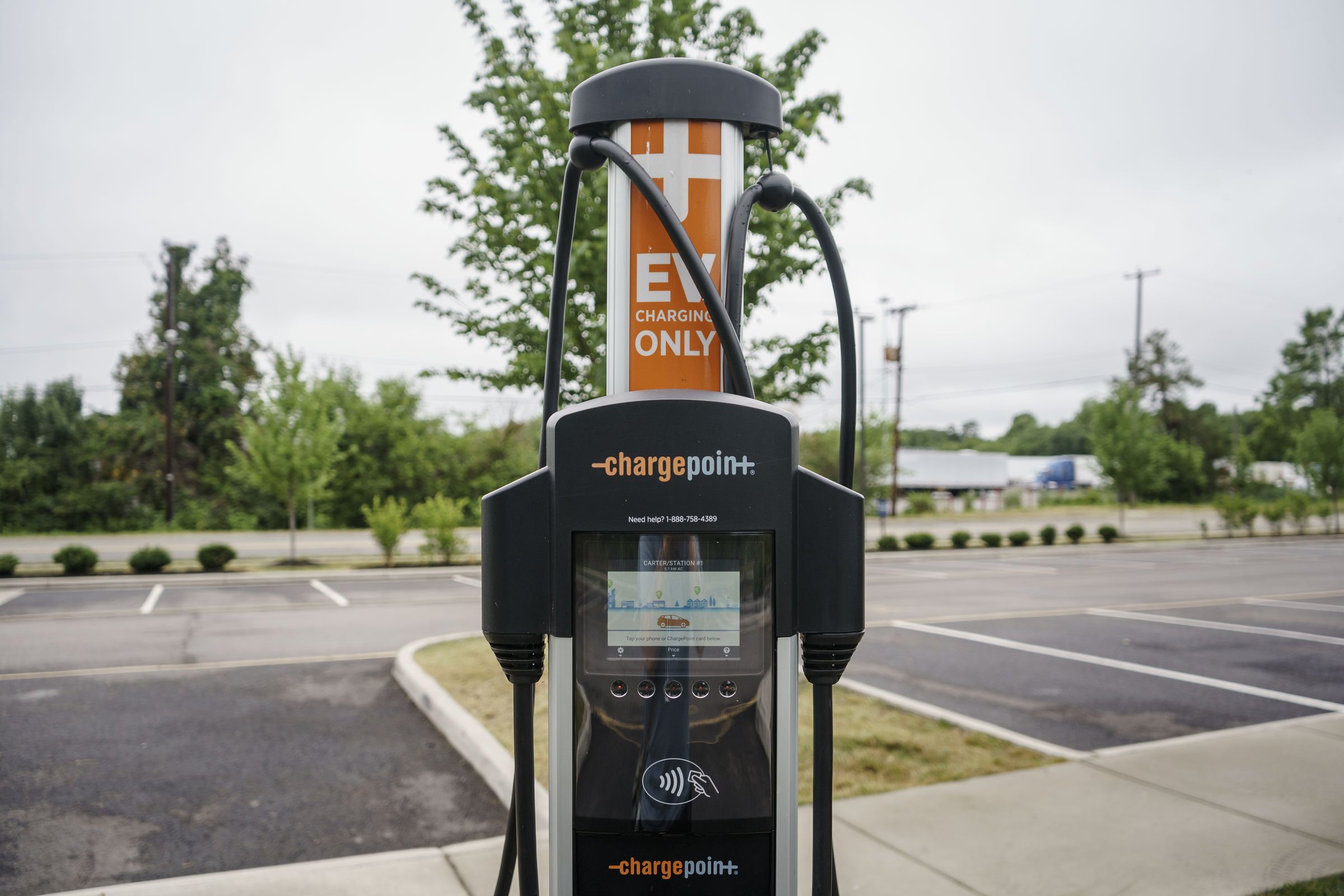 A chargepoint charger stationed in the middle of a car park.
