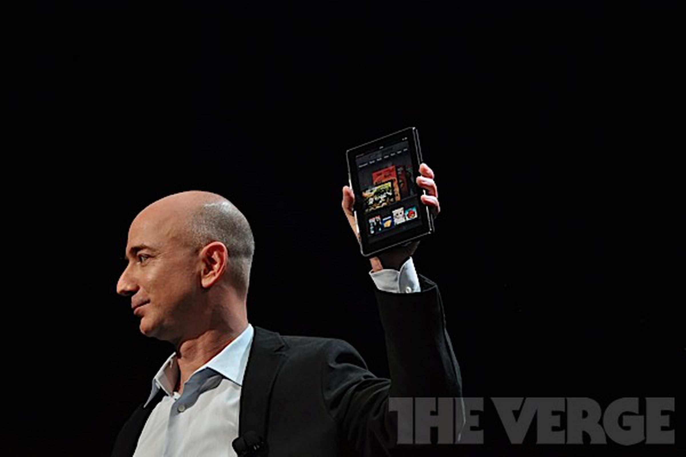 Jeff Bezos holding the Kindle Fire