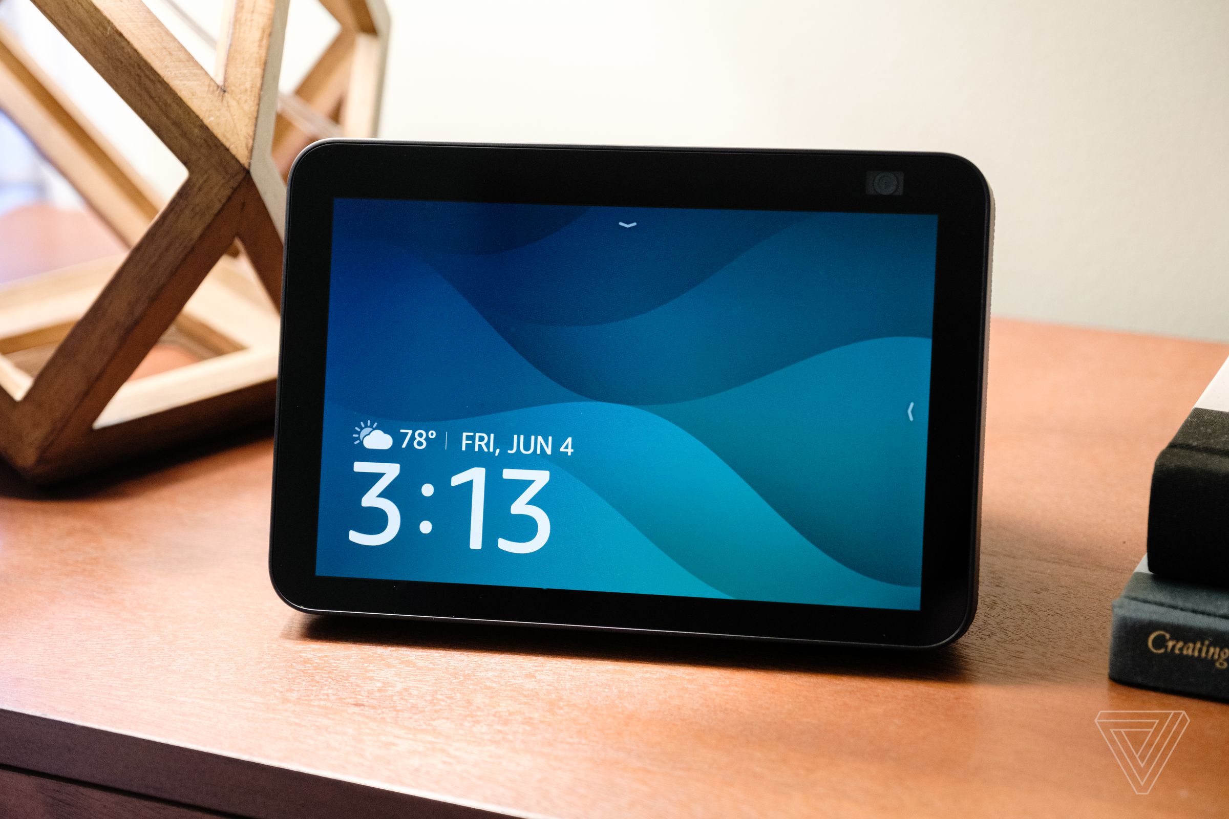The second-gen Echo Show 8 with its main screen on display and resting on a table.