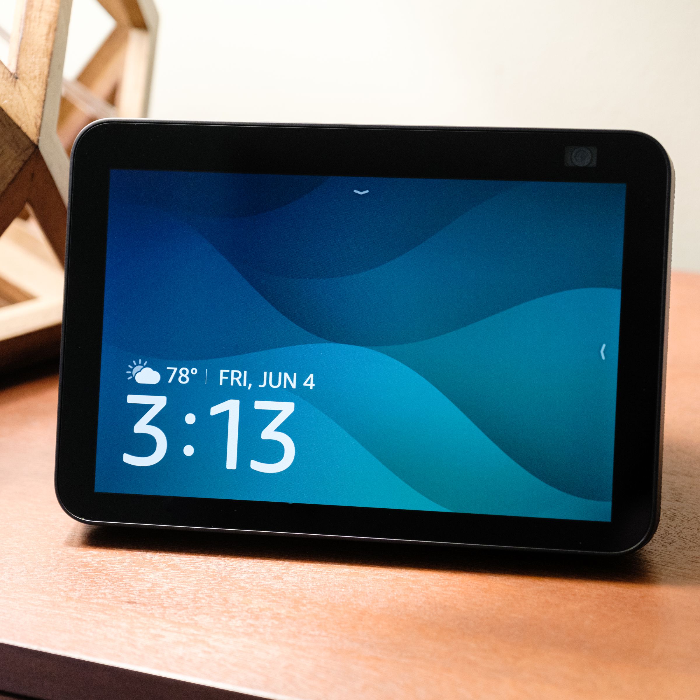The second-gen Echo Show 8 with its main screen on display and resting on a table.
