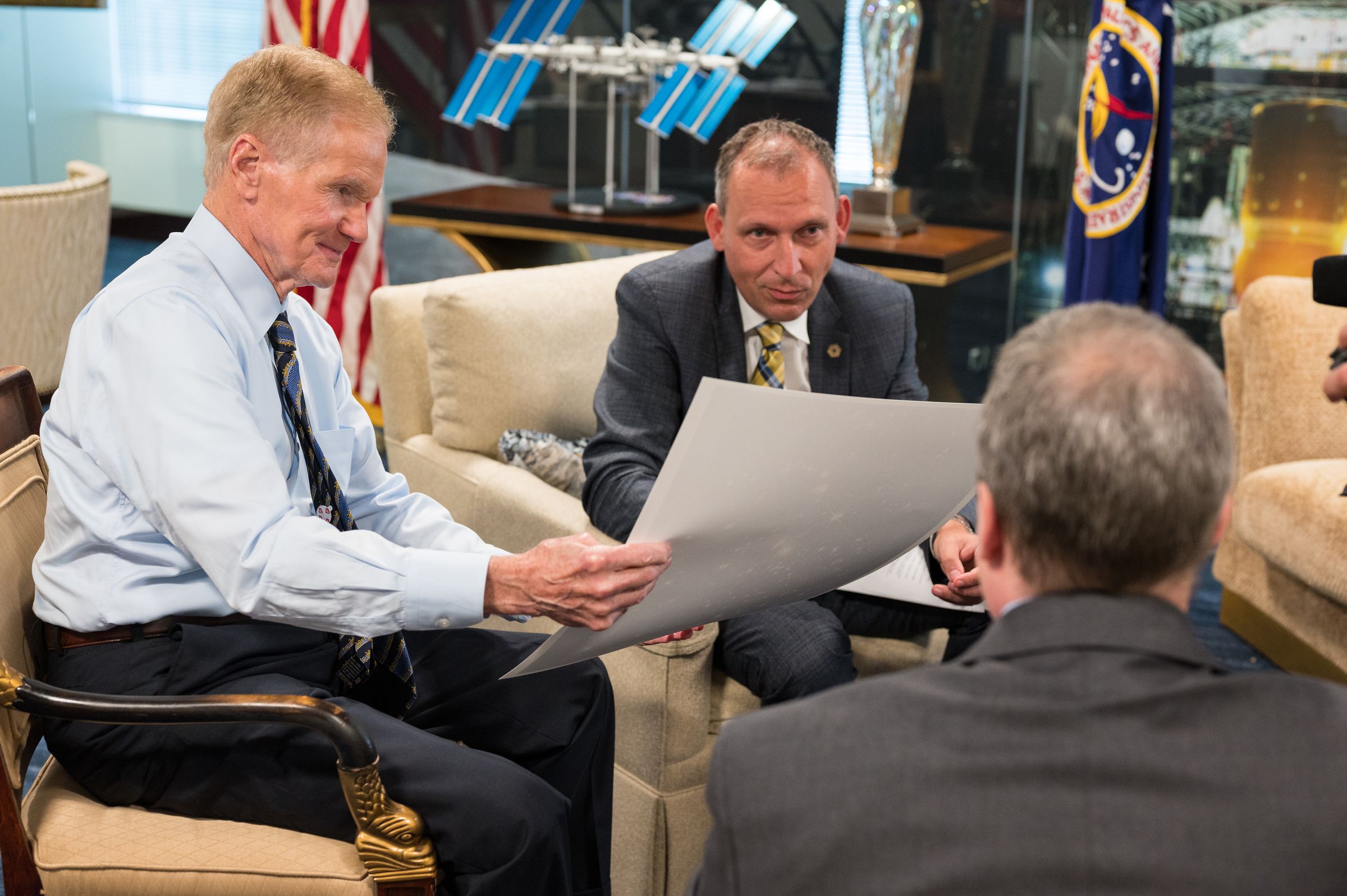 NASA administrator Bill Nelson (L) takes a look at the first full-color image taken by JWST.