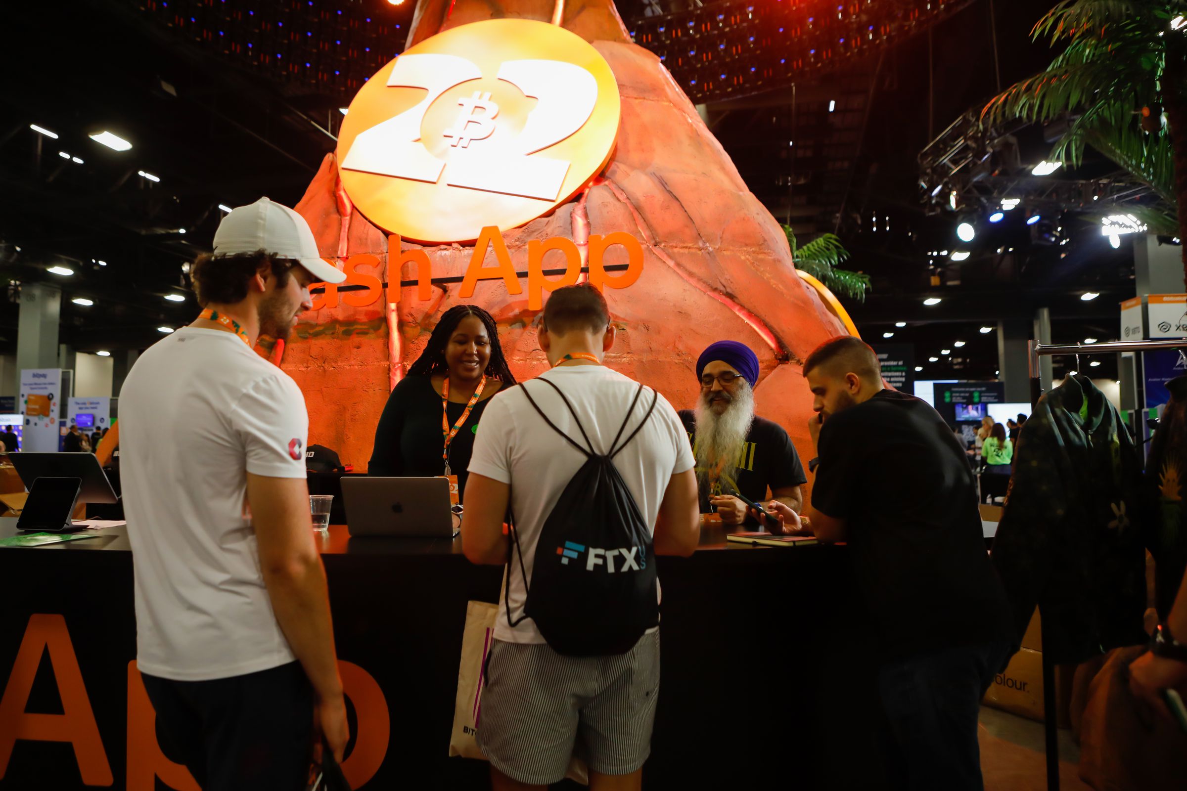 Attendees visit the Cash App stand during the Bitcoin 2022 conference in Miami, Florida, U.S., on Wednesday, April 6, 2022.