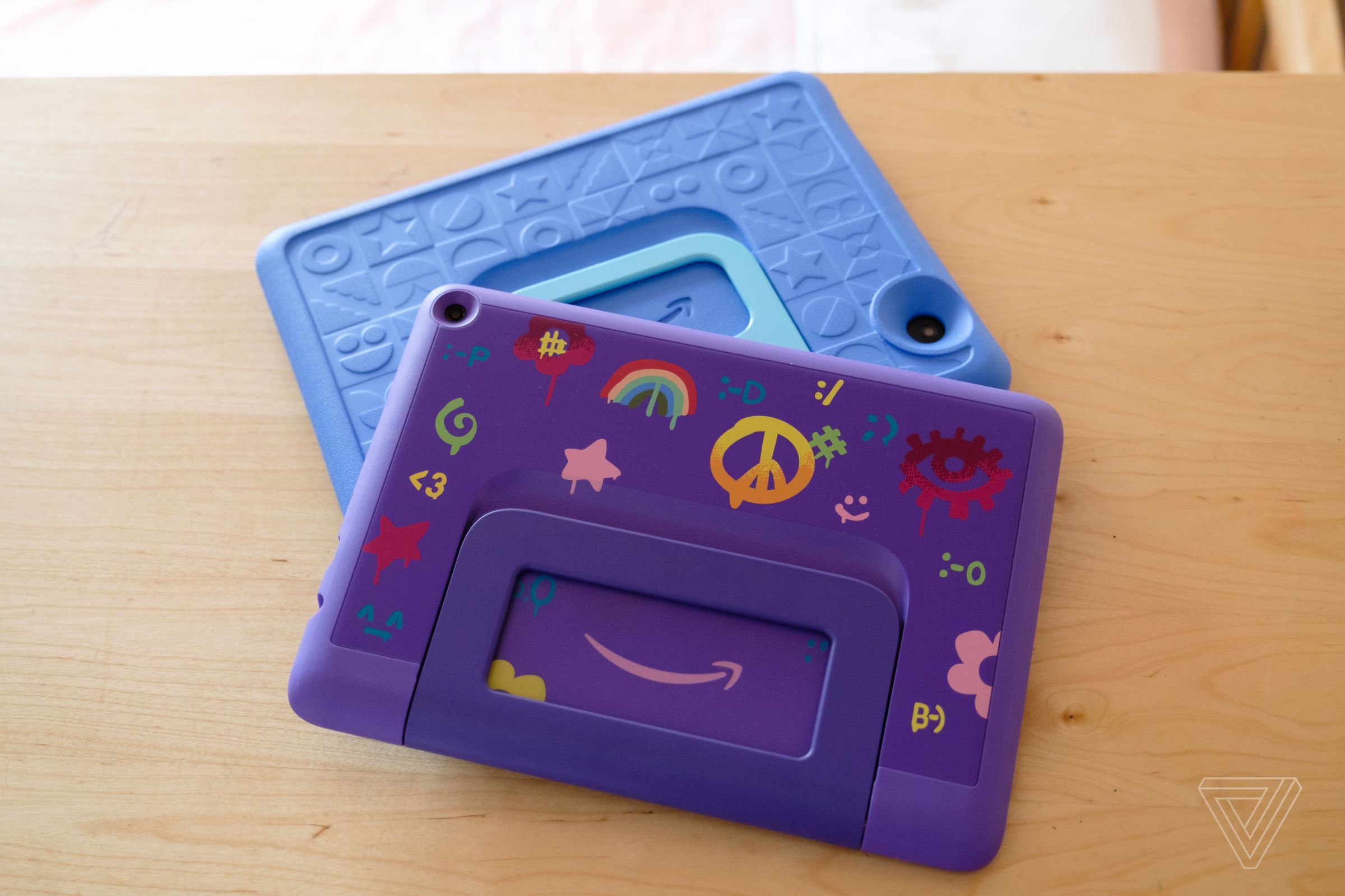 The Kids edition for younger children has a chunky, spongy case; the model for older kids has a slimmer plastic one.