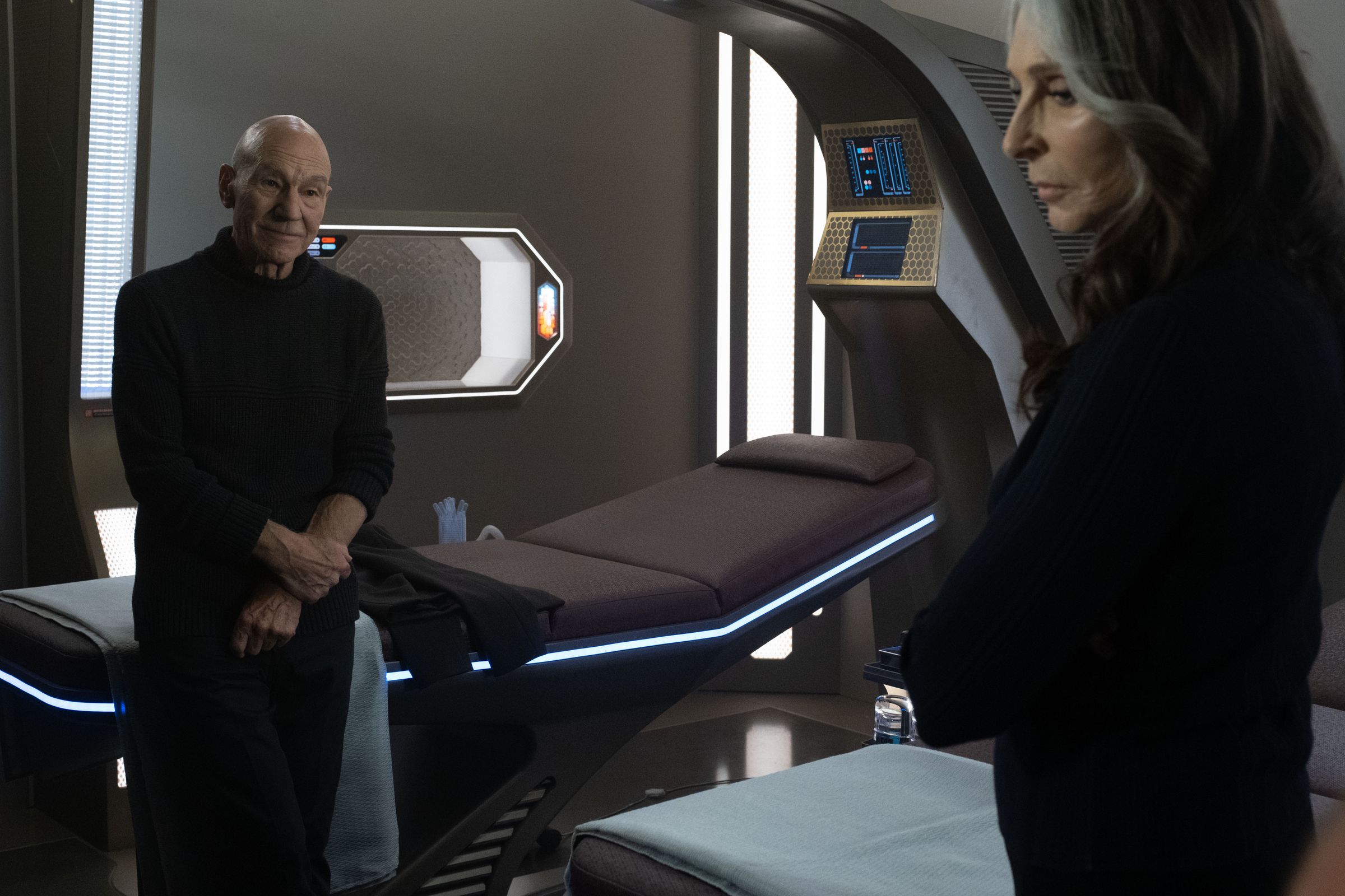 Patrick Stewart looks at Gates McFadden, they are both Acting.