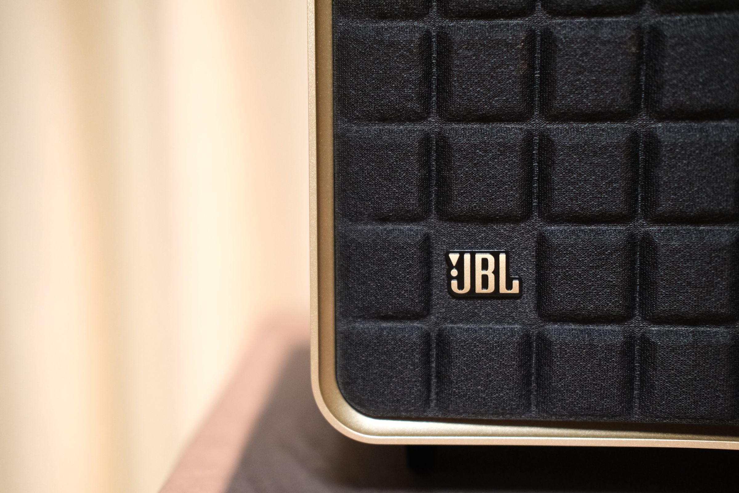 Close up of JBL logo on speaker grill.